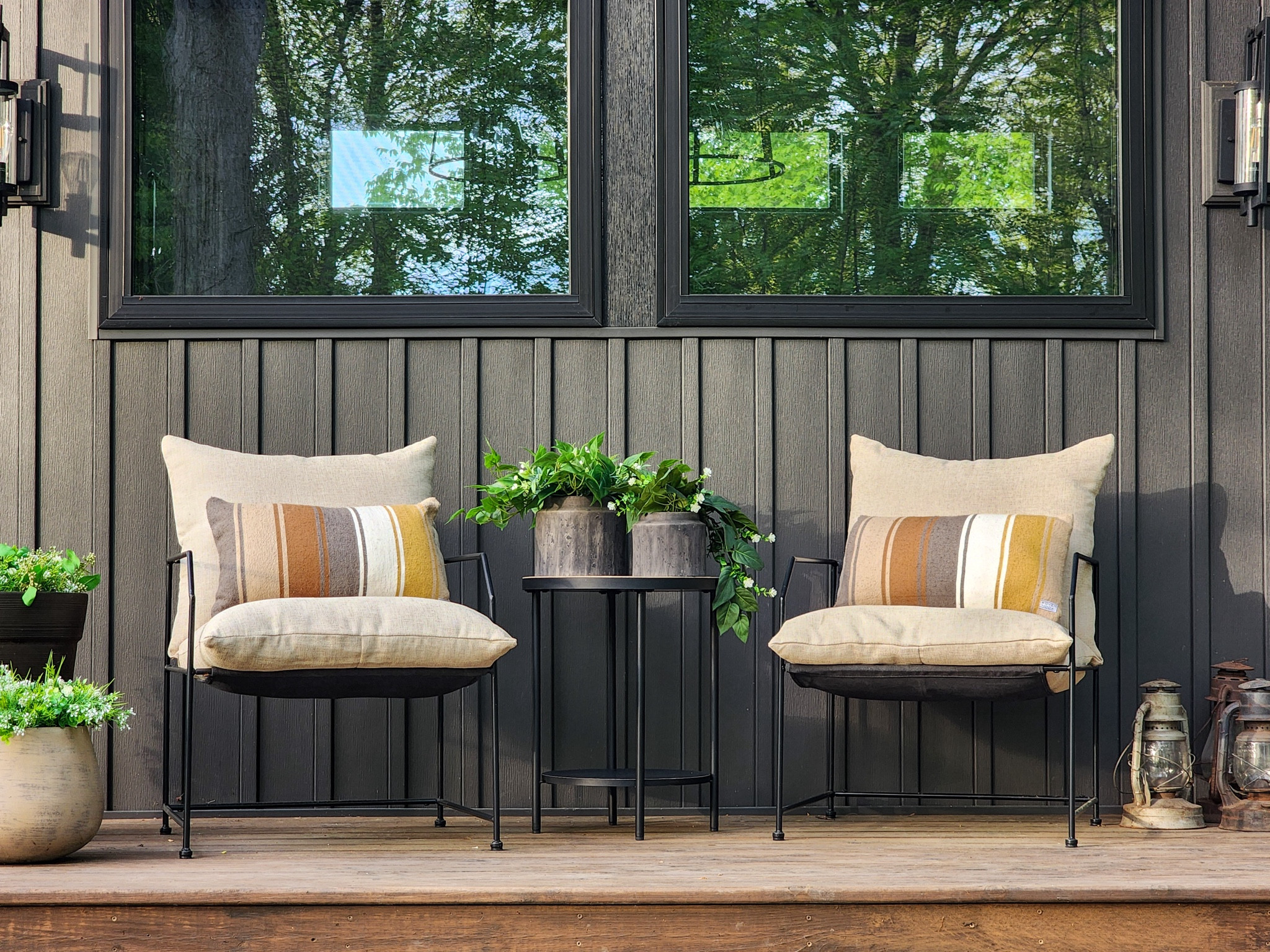 For this year's spring - summer front porch look, I used most of the same decor from last season with a sprinkle of new additions. 

Old || Large cement planters filled with faux greenery + flowers • Striped lumbar pillows • black round transitional accent table • botanical wreath • natural modern geometric door mat • Chris Loves Julia x Loloi Humphrey layering rug

New || Contemporary metal chairs with tan cushions • Tabletop viral planters from Walmart filled with new and old artificial greenery + flowers • Vintage lanterns • (Not pictured, but ordered) Metal planter stand to display vintage lanterns

#LTKHome #LTKSeasonal