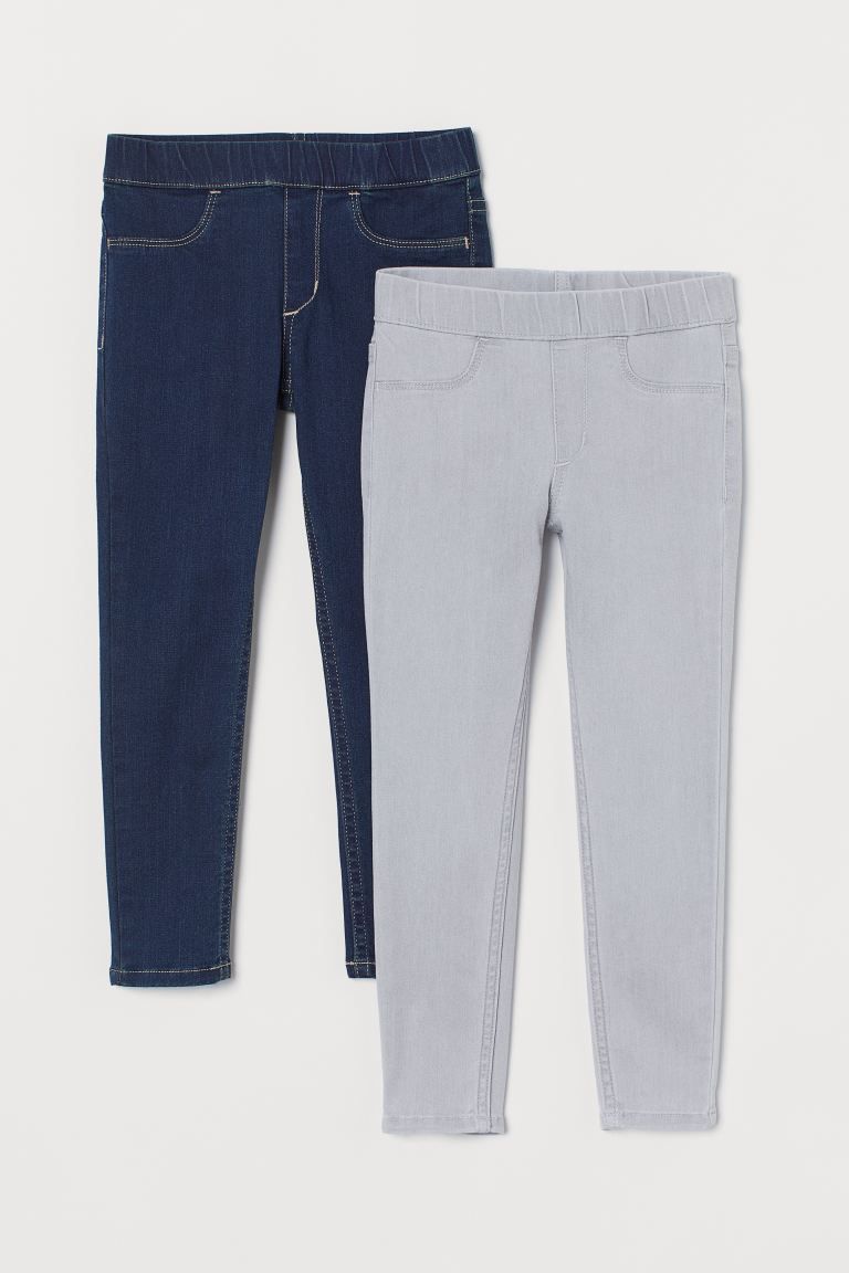 Two pairs of leggings in different colors of washed stretch denim. Elasticized waistband, mock fr... | H&M (US + CA)