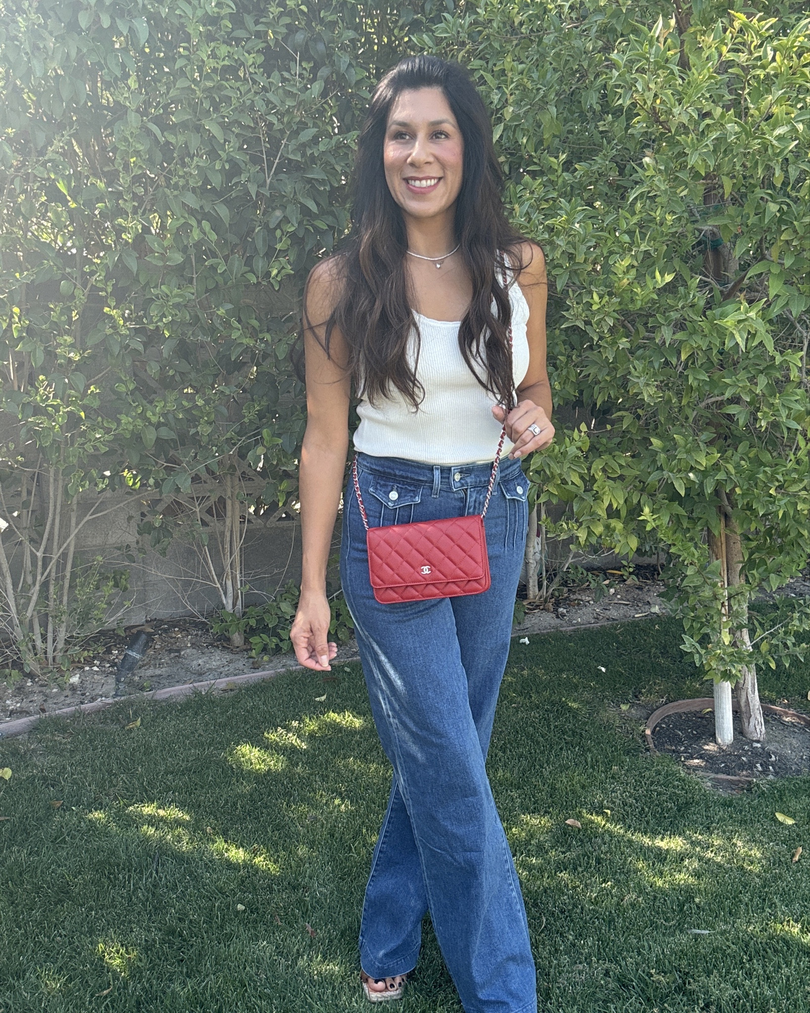 Effortlessly chic in high-waisted denim with front pocket detailing, perfectly paired with a classic white tank. Adding height with comfy wedges and a pop of color with my red crossbody purse. Loving this laid-back yet polished look! ❤️👖👡 #OOTD #DenimDays #CasualChic 

#LTKFindsUnder50 #LTKSeasonal #LTKStyleTip