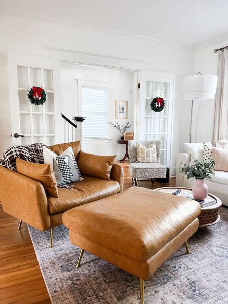I just love watching Christmas slowly appear  throughout our house! I’m really starting to love the way everything is coming together here! I’ll never stop swooning over this Albany Park oversized vegan leather chair!!

#livingroom #christmasdecor #classicdecor #midcenturymodern #mcm #leatherchair #albanypark #westelm #loloirugs 

#LTKhome #LTKHoliday #LTKSeasonal