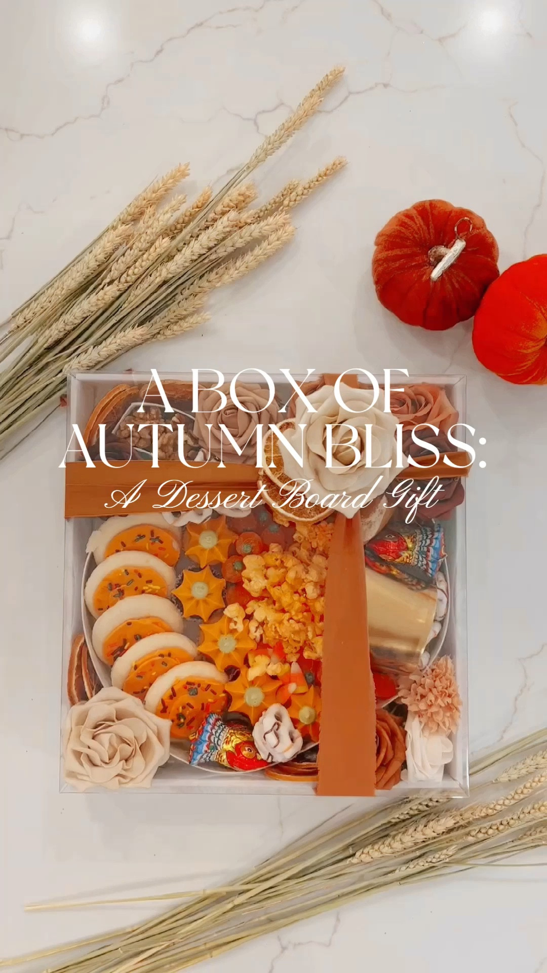 I've created a fantastic dessert board that's perfect for Fall. It starts with a cardboard square box, and inside, there's a cute pumpkin-shaped box with a clear plastic cover, giving it that Fall charm.
Now, onto the goodies. I filled the pumpkin with iced sugar cookies, pumpkin whoopie pies, and some yummy cupcakes. Cupcakes are the real stars here, with their swirls of frosting. In the middle, there's a cascade of popcorn for that irresistible crunch.
But that's not all – we've got pumpkin candies, candy corn, white chocolate pretzels, and walnuts pretending to be pumpkin stems. Plus, two turkey-shaped chocolates for a playful touch.
After loading up the pumpkin, I filled any gaps with faux flowers and dried oranges to set the Fall mood. The lid got a silk ribbon decoration, and I added a single flower and a couple of orange slices for that finishing touch.
This dessert board isn't just delicious; it's a showstopper, and it's quite big too! Whether it's for a hostess gift or a potluck party, it's a delightful way to embrace the Fall spirit. Enjoy, and here's to a fabulous Fall season! 🍂🍰🧁✨

#LTKSeasonal #LTKparties #LTKhome