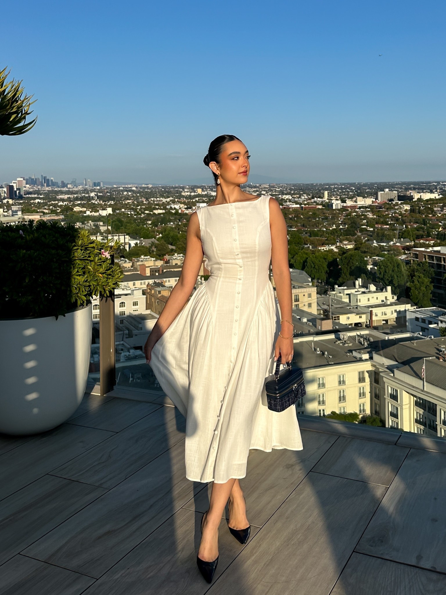 Open back white midi dress 

#LTKBeauty #LTKSeasonal #LTKStyleTip