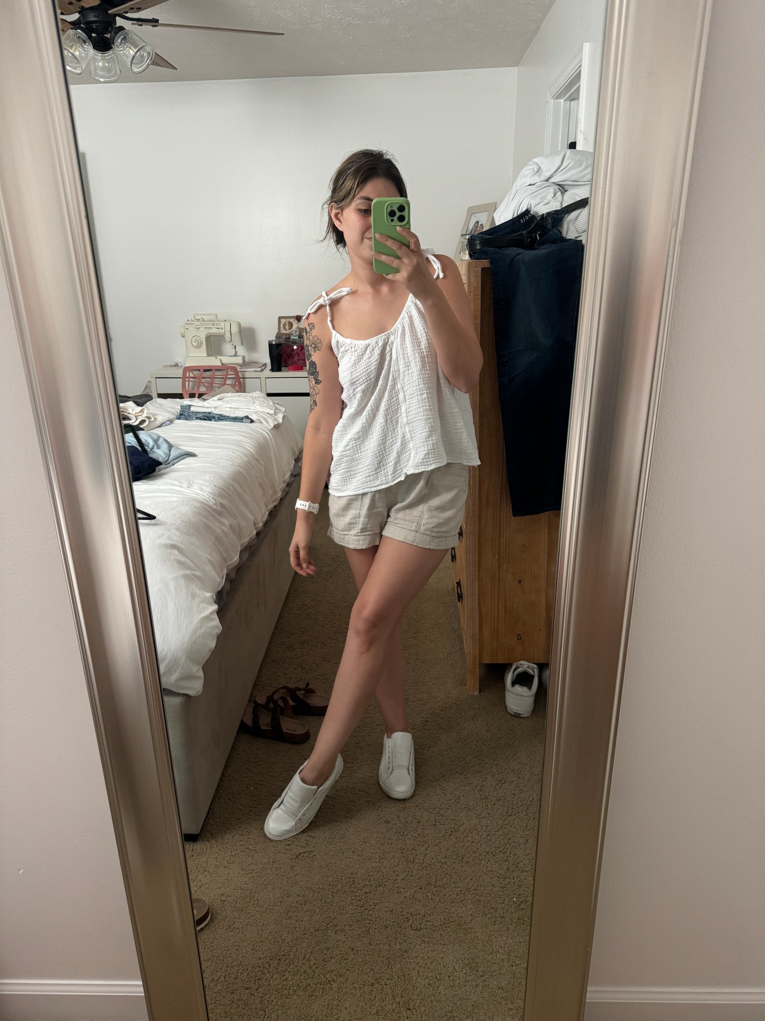 casual summer outfit, casual summer style, coastal summer outfit, coastal beach outfit that includes Old Navy tan linen shorts in a size small, a flowy white tank top from Old Navy, I linked similar ones, I bought this one last season, and white nautica sneakers. I have had these for a few years. #ltksummer #summerfashion #summeroutfit #Oldnavy #ltkoldnavy #coastalfashion #beachoutfit   

 #LTKSeasonal #LTKFindsUnder50 #LTKShoeCrush
