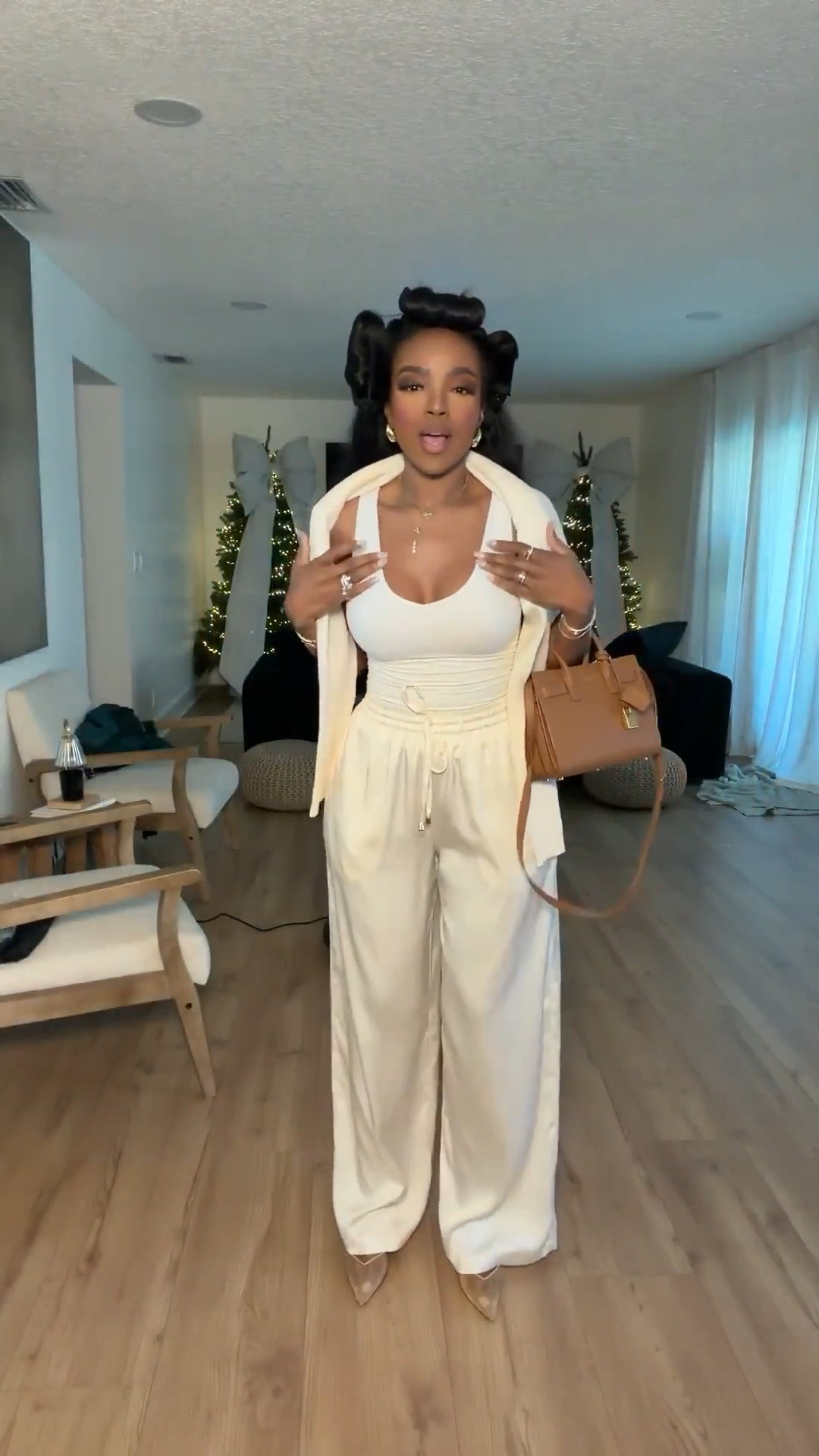 Cost per wear on elevated neutrals will always win — this monochrome cream set styled multiple ways instantly gives rich mom running errands energy while keeping it effortless and polished. The soft tailored vest layered over a fitted tank with high-waisted pleated trousers creates a flattering waistline and elongates the legs. Classic pointed heels and a structured tan handbag pull everything together for that understated luxury feel.

Perfect for school drop-offs, coffee meetings, casual client days, brunch, errands, travel days, and daytime events.

📏 Sizing:
Wearing size Small  
Trousers: 4 Long  
Height: 5’4”  
Weight: 138 lbs  
Bust: 34D  
Waist: 27”  
Hips: 40”

This neutral tailored set, cream wide leg trousers, structured vest outfit, quiet luxury mom style, elevated everyday look, chic airport outfit, and rich mom aesthetic are staples you can restyle season after season as the cost per wear drops and your long-term shopping strategy builds a timeless wardrobe.

Favorite to revisit later and shop instantly on the app.

Follow me on Instagram and YouTube @kirasfashionfinds