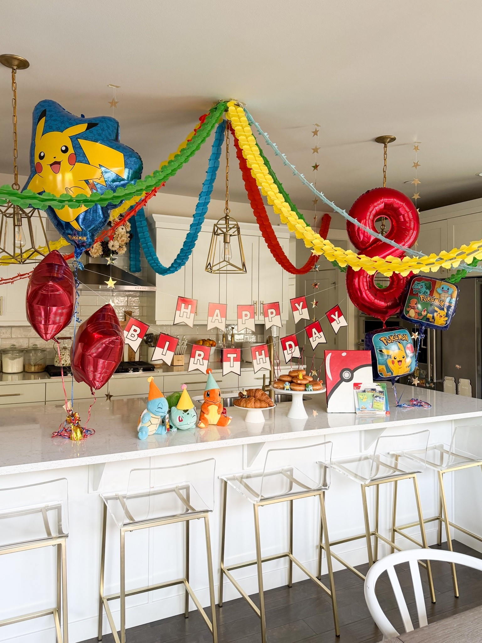Pokemon birthday set up for my nephew! 

Birthday banner, streamers garland, balloons, Pokemon plush, stuffed animals, Pokemon battle figure, candles, hanging stars
