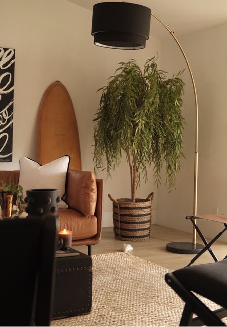 Amazon willow tree! It’s so gorgeous in person it looks real. 
Jute rug 
Surfboard 
Leather ottoman 
Leather sofa 
#meandmrjones 

#LTKunder100 #LTKunder50 #LTKhome