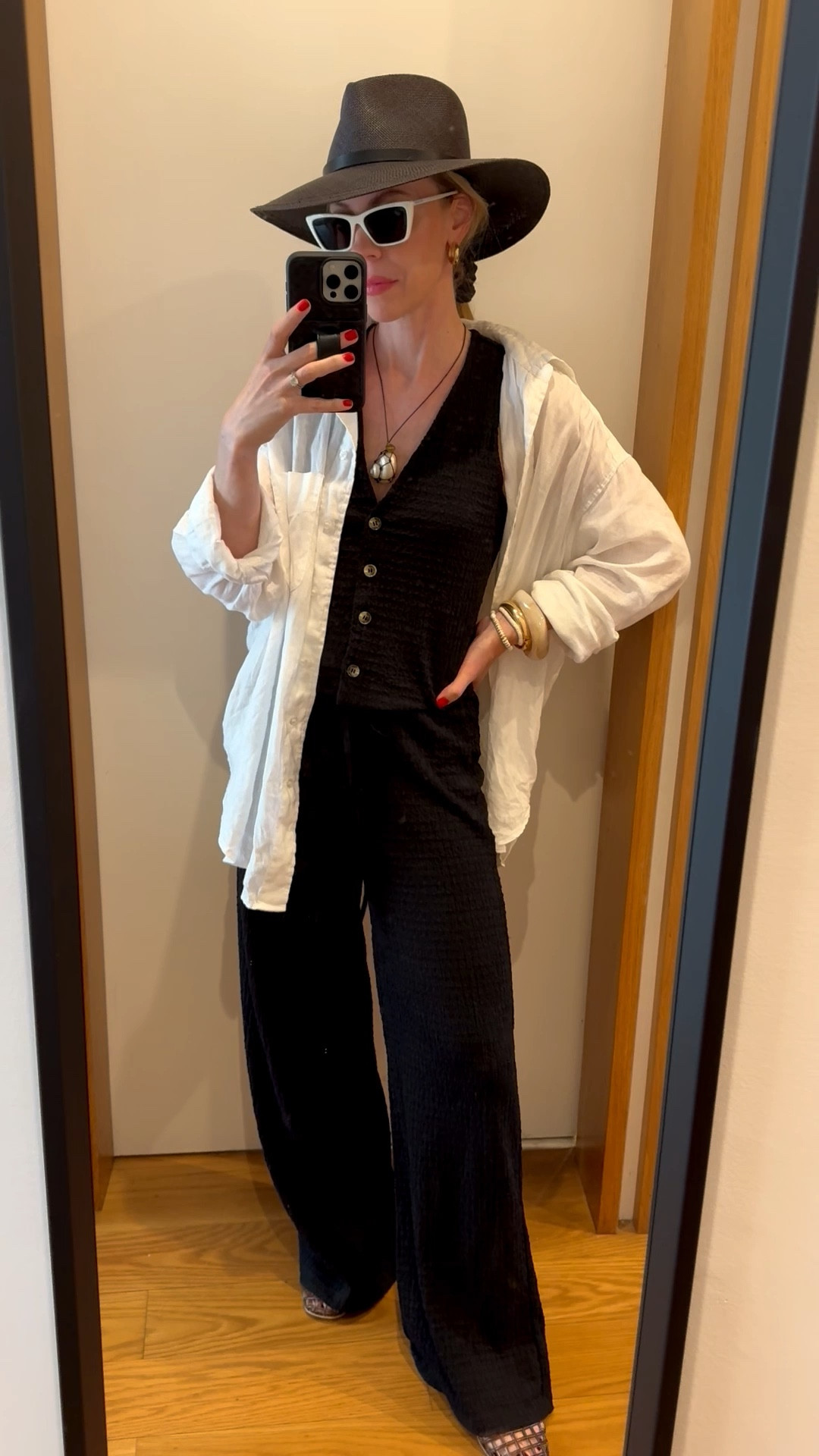 Beach outfit, summer vacation outfit, black straw hat, linen shirt, vest pants set, jelly shoes, shell necklace 

#LTKOver40 #LTKTravel #LTKSeasonal