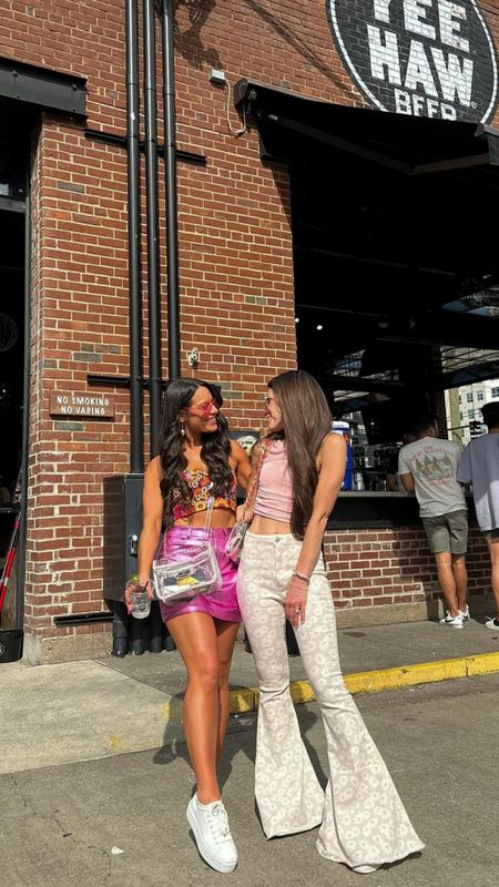 Nashville outfit ; pink outfit ; bachelorette party outfit ; day drinking outfit ; pink bag strap ; concert outfit ; concert bag 

Daisy flares sold out, linked other cute flare jeans 

#LTKFindsUnder50 #LTKSeasonal #LTKStyleTip