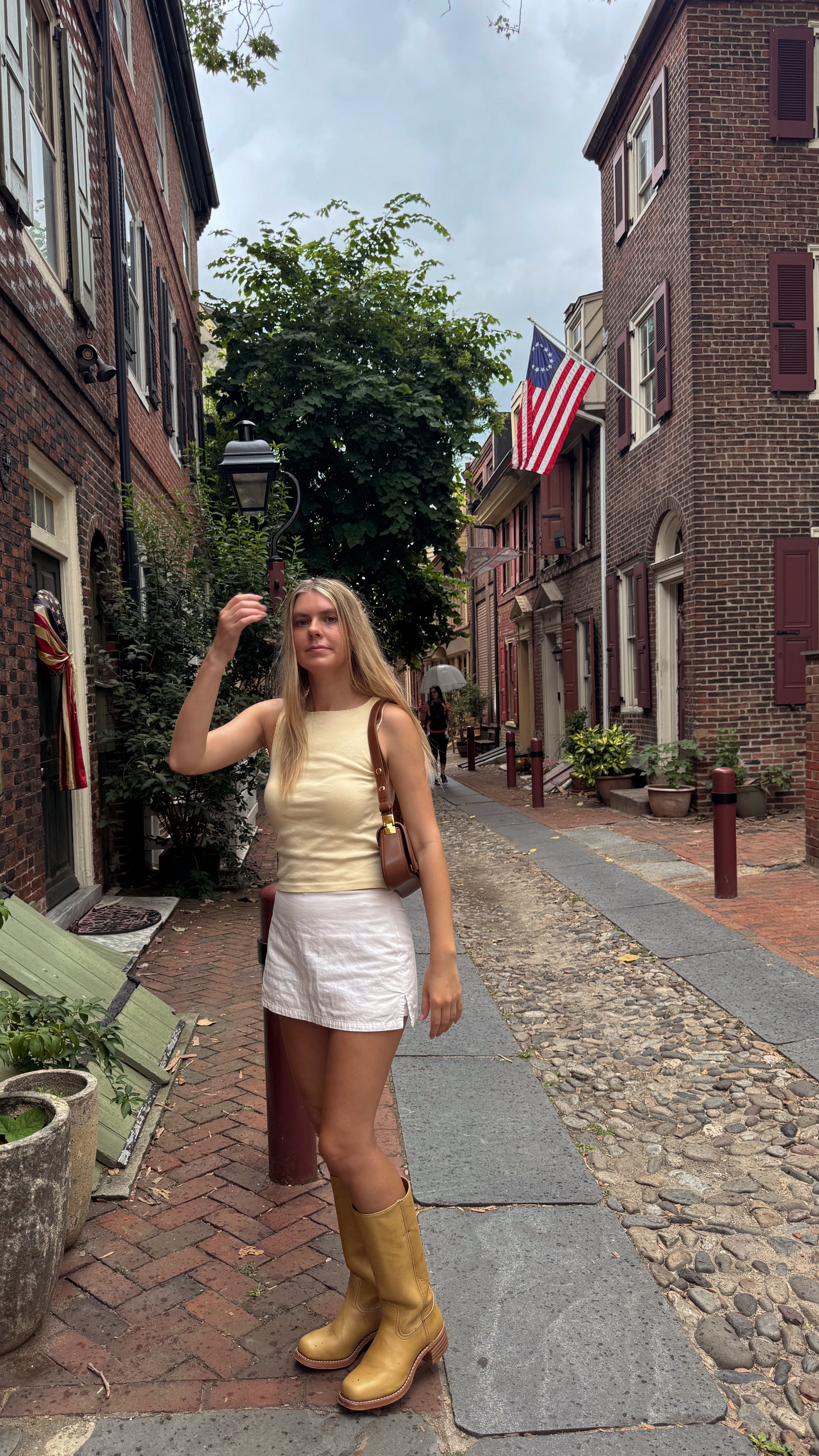 yellow and white outfit for east coast summer 💛 I’m wearing a size 2 in the skort and an 8.5 in my boots, but could have sized down! 

#LTKTravel #LTKStyleTip #LTKShoeCrush