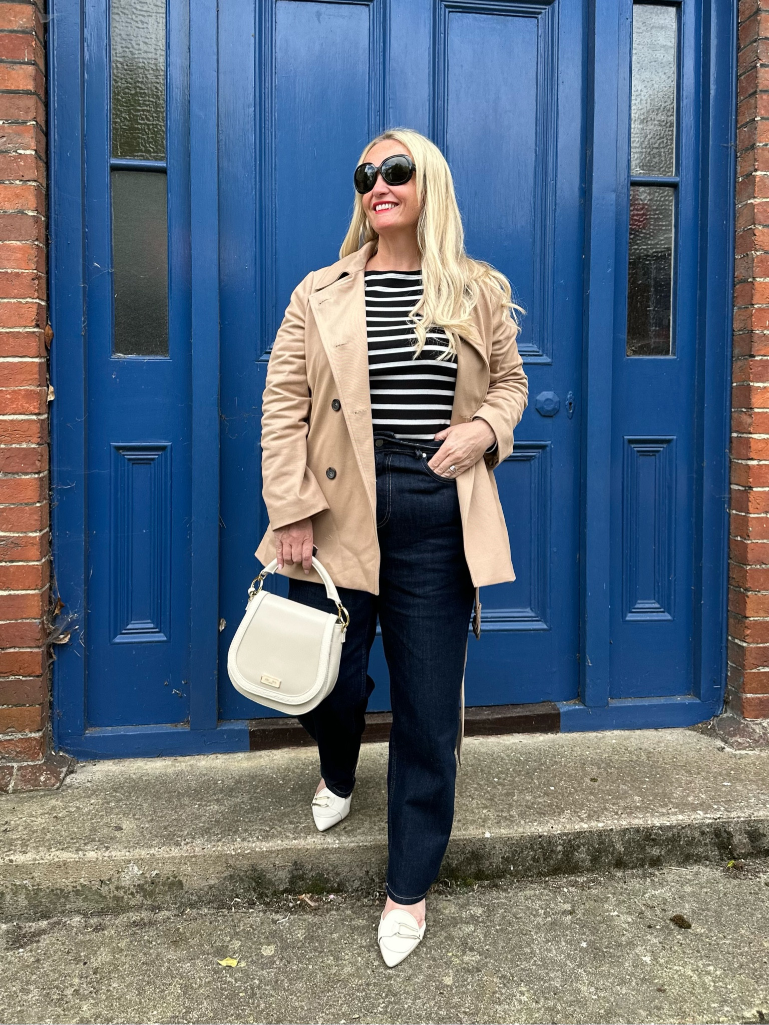 I’m wearing a head to toe look here from @saintandsofia. Barrel leg jeans in indigo, Marion double breasted short trench in beige, Austen boat neck tee in black stripe, Bridget sling back heels in cream and the Saddle bag in cream. 

#LTKmidsize #LTKjeans #LTKpetite
