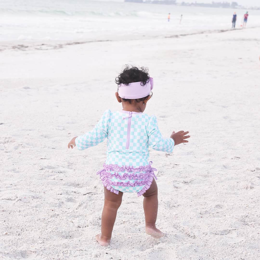 Long Sleeve Rash Guard With Ruffle Bottom | All Checked Out | Caden Lane