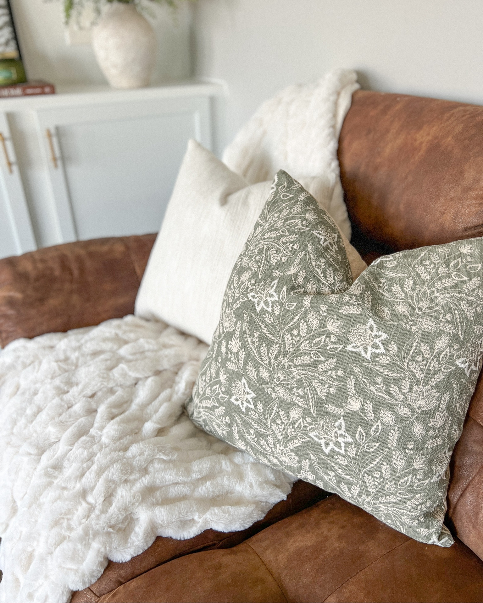 Throw pillow x winter and great for a transition to spring in a soft sage/olive green 🫒and the faux fur throw blanket perfect for winter couches living room decor. The throw blanket not also adds that soft and cozy texture and also a luxurious look.

Walmart Finds 
Winter decor
Winter decorating
Home decor
Living room decor

#LTKhome #LTKSeasonal