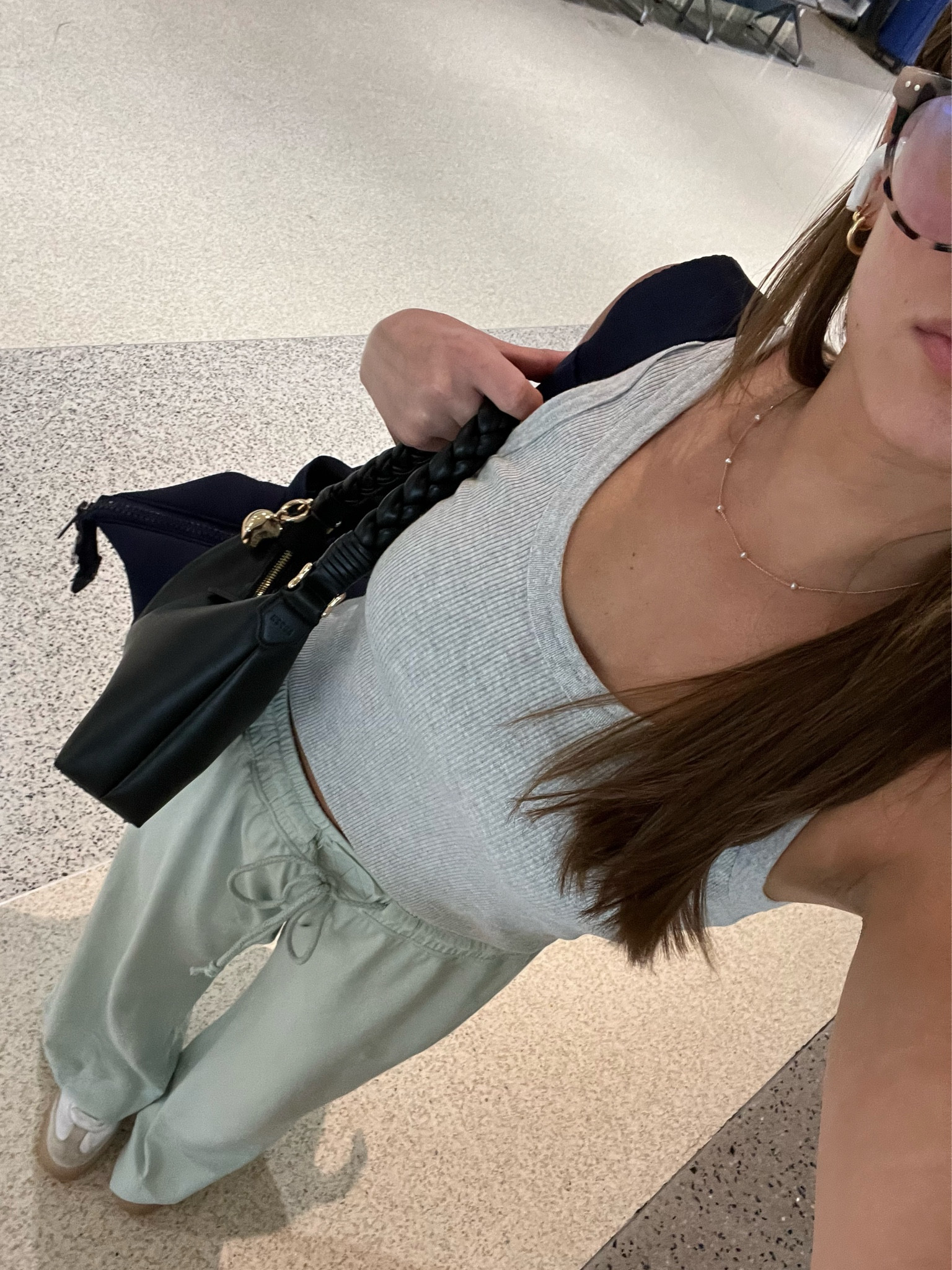 wearing XS in pants (short girl friendly!!) and XS in tank. Tank is normal length but I folded under to make it cropped! Shoes I did half size down :) linked my exact travel bags & glasses! 

#LTKTravel #LTKShoeCrush #LTKItBag