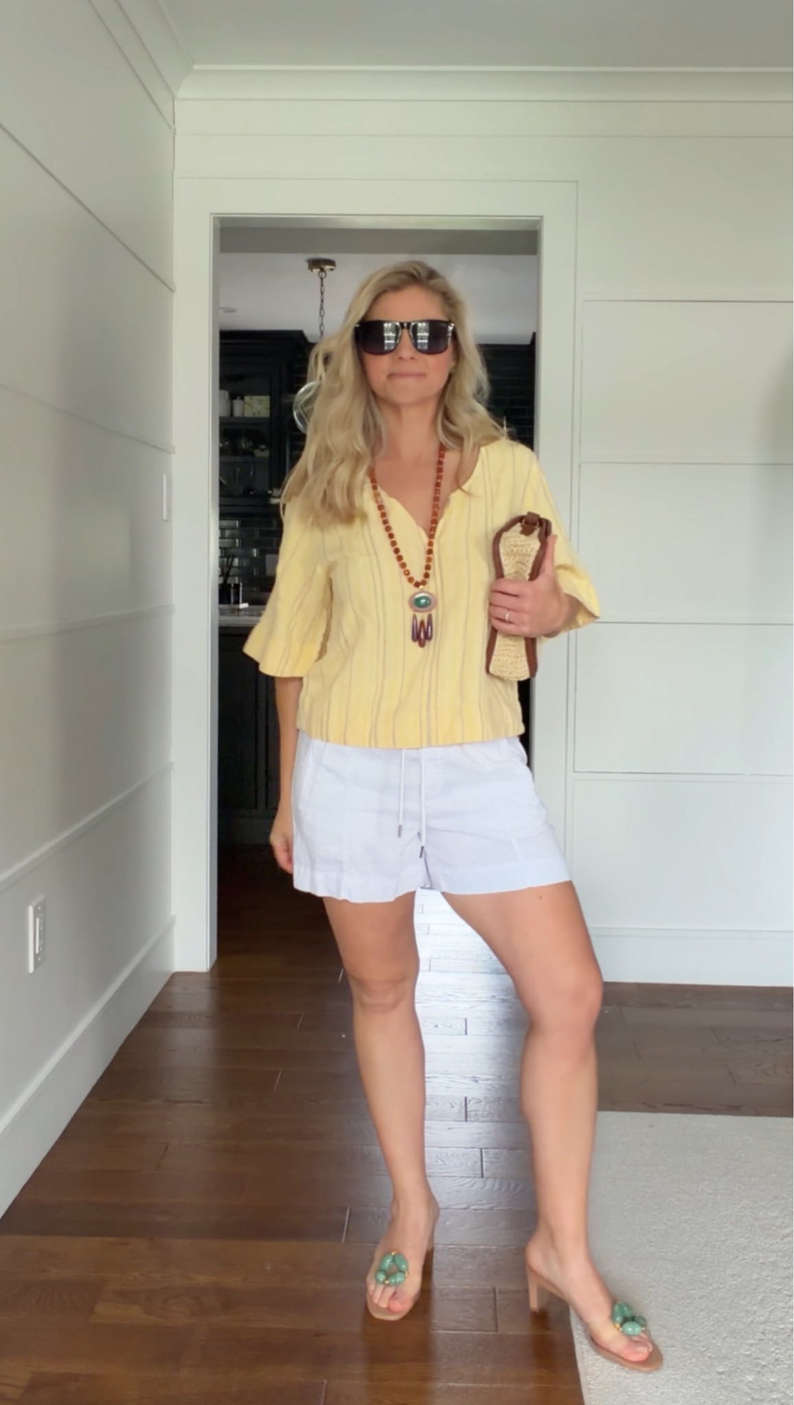 Easy, effortless, and ready for anything ☀️

Lightweight yellow blouse + linen shorts = the perfect warm-weather combo. Finished with my go-to statement necklace, raffia clutch, and these heels to elevate it just enough.

This is one of those outfits that works from coffee to beach to dinner without overthinking it…just swap the shoe for a sandal or sneaker and you’re set.

A simple formula I always come back to:
easy top + relaxed short + statement accessories = instant outfit.

#LTKootd #LTKSeasonal #LTKTravel