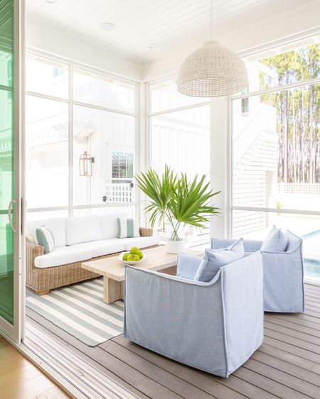  A look at our outdoor living room in our screened in porch! We absolutely love this outdoor sofa, upholstered swivel chairs, wood coffee table, rope chandelier, striped outdoor rug and coastal accents! See our full new home tour here: https://lifeonvirginiastreet.com/a-peek-at-our-new-florida-home/.
.
#ltkhome #ltkseasonal #ltkstyletip #ltkfindsunder50 #ltkfindsunder100 #ltksalealert #ltkfamily outdoor living room, pool furniture, patio furniture, blue and white decor, coastal grandmillennial style

#LTKsalealert #LTKhome

#LTKHome #LTKSaleAlert #LTKSeasonal