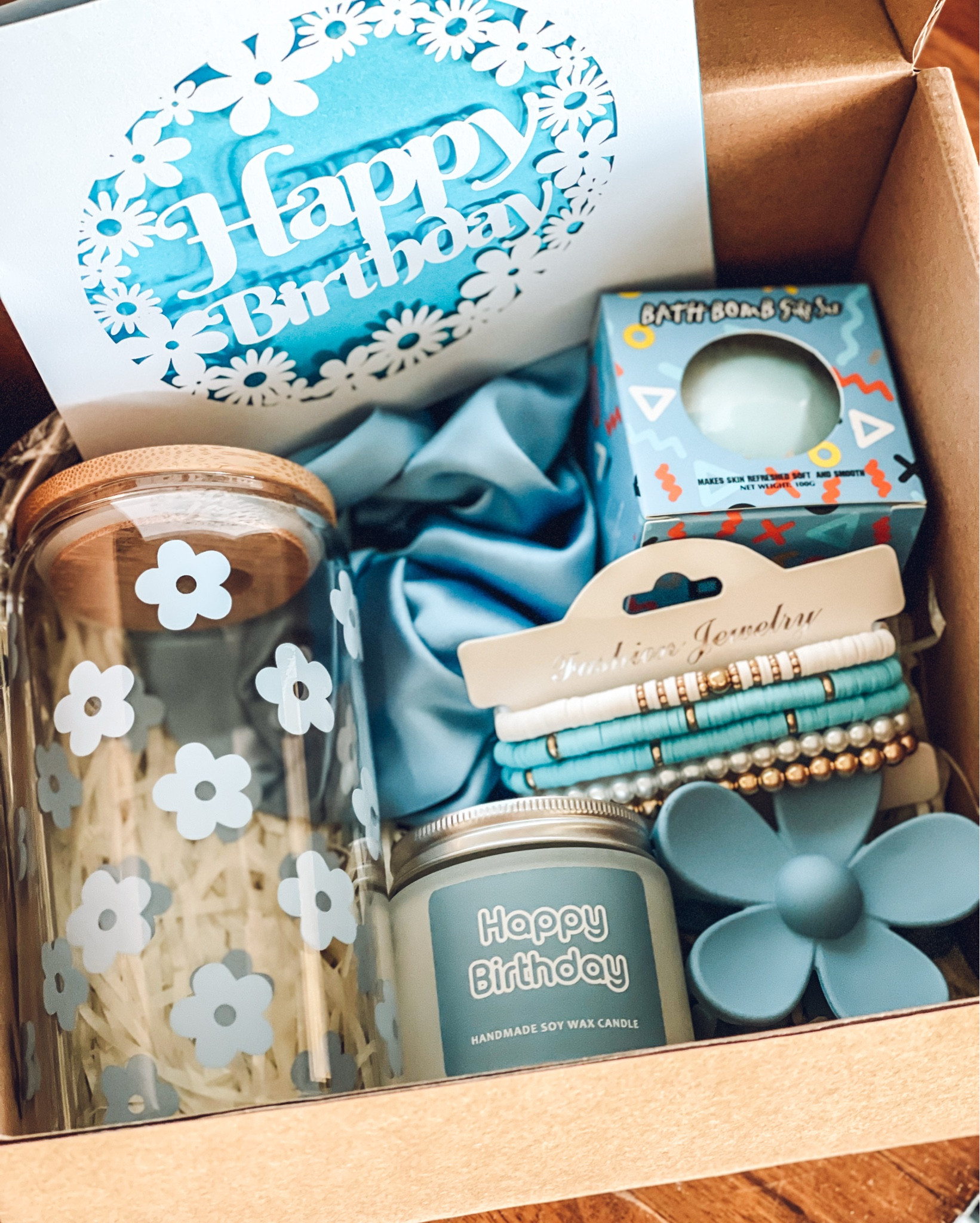 The sweetest little birthday gift for a sweet little pre-teen! 💙

My daughter picked out this adorable gift box for her friend whose favorite color is blue! I purchased it on Amazon + it comes with everything you need! I added a homemade bow for an extra special touch!

•box (says happy birthday on the top)
•crinkle paper filler 
•blank happy birthday card to write in
•glass floral cup + straw
•silk scrunchie
•birthday candle
•bath bomb
•beaded bracelets 
• floral claw clip

Simple, cute + affordable —it’s a mom WIN! 

#LTKKids #LTKParties #LTKGiftGuide