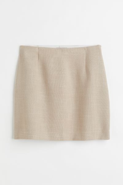 Conscious choice  Short, slim-fit skirt in woven fabric. High waist, elasticized waistband, and c... | H&M (US + CA)