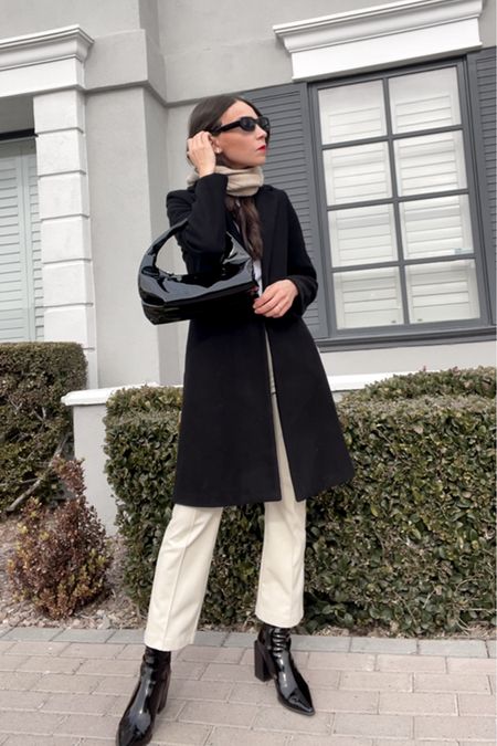 Cream leather pants outfit with black coat and balaclava scarf ☕️

Black coat
Shiny bag
Shiny boots
Black long coat
White leather pants
Faux leather pants
White leather pants outfit
Winter coat outfit 
Winter outfit 