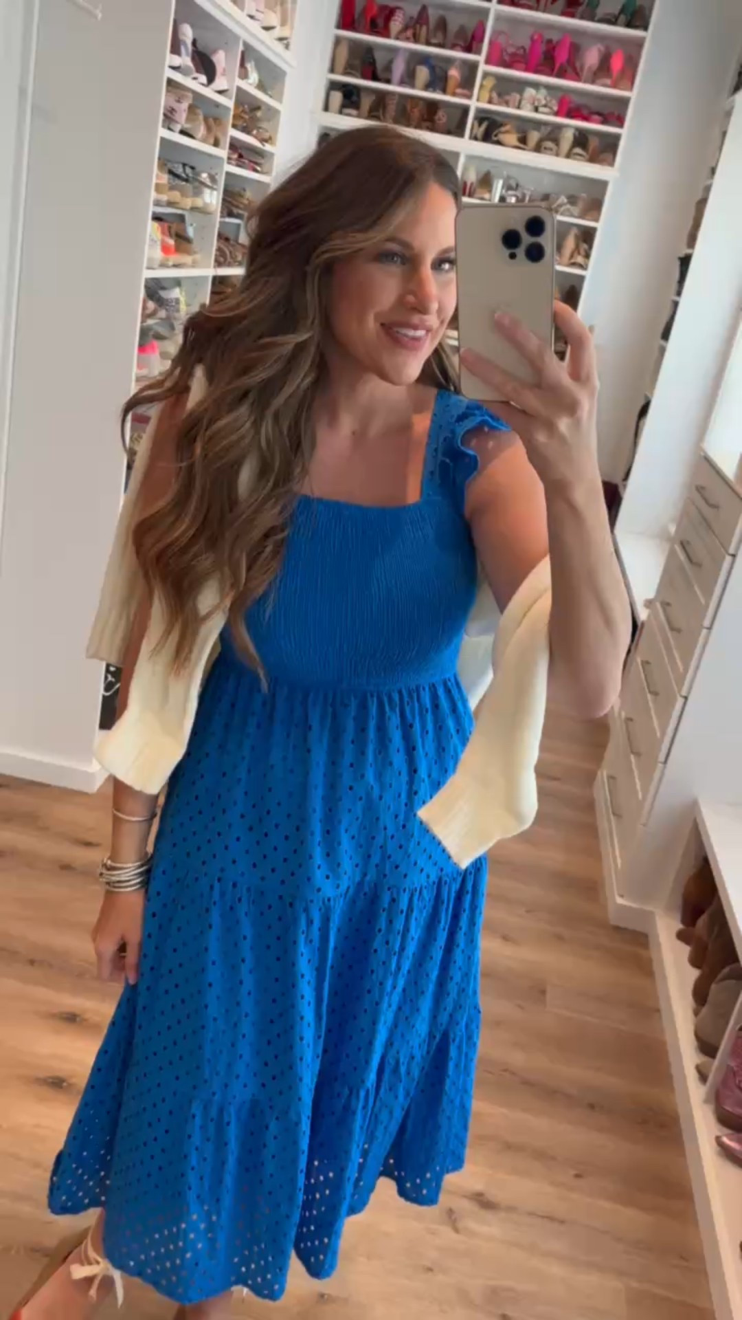 In a small ruffle shoulder eyelet maxi, large American flag sweater, tie up espadrille wedges and accessories for patriotic look- fits tts.

#LTKStyleTip #LTKFindsUnder50 #LTKSeasonal