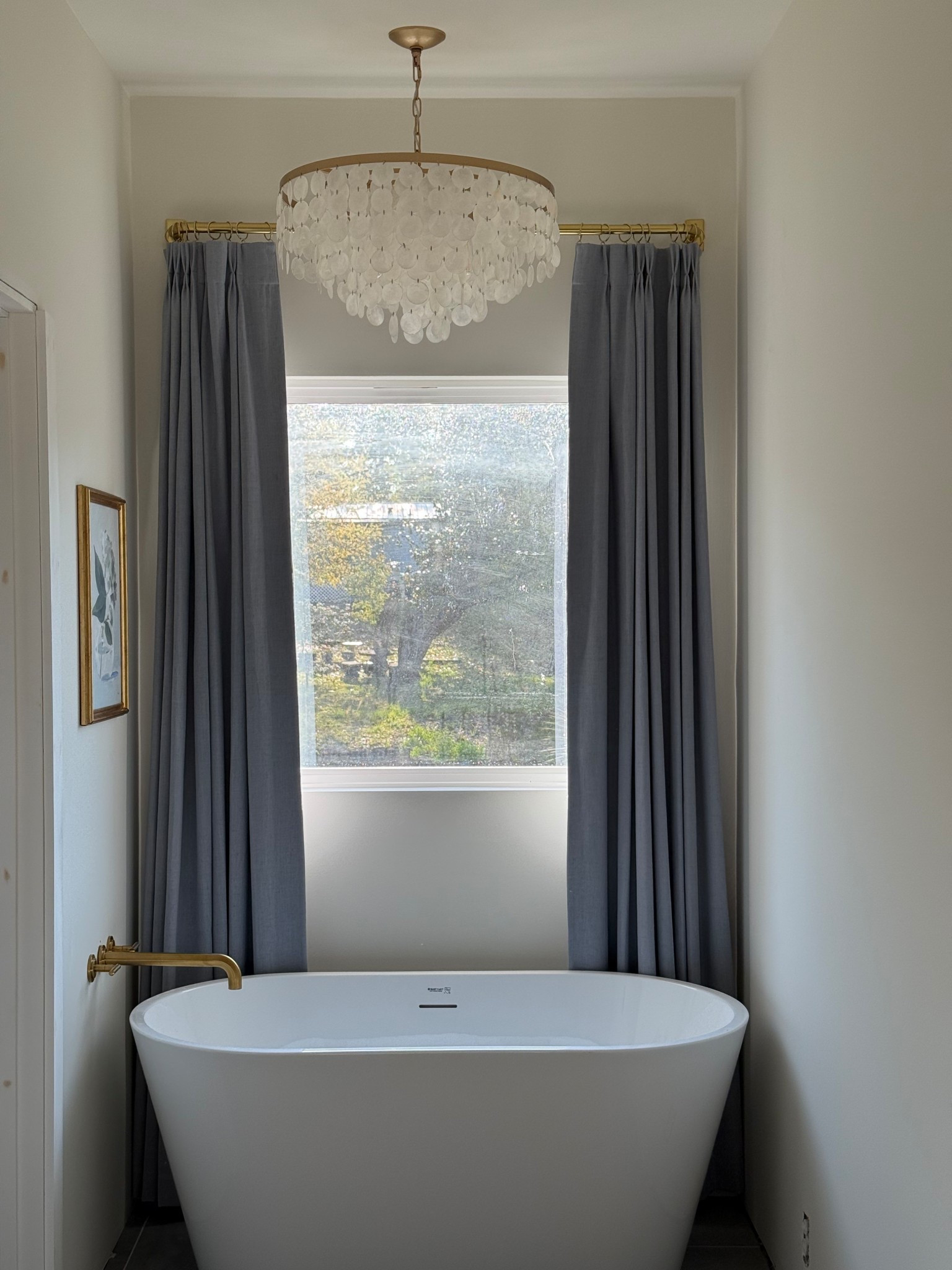 Freestanding tub. Chandelier. Wall faucet. Curtains. Curtain rod  

#LTKHome