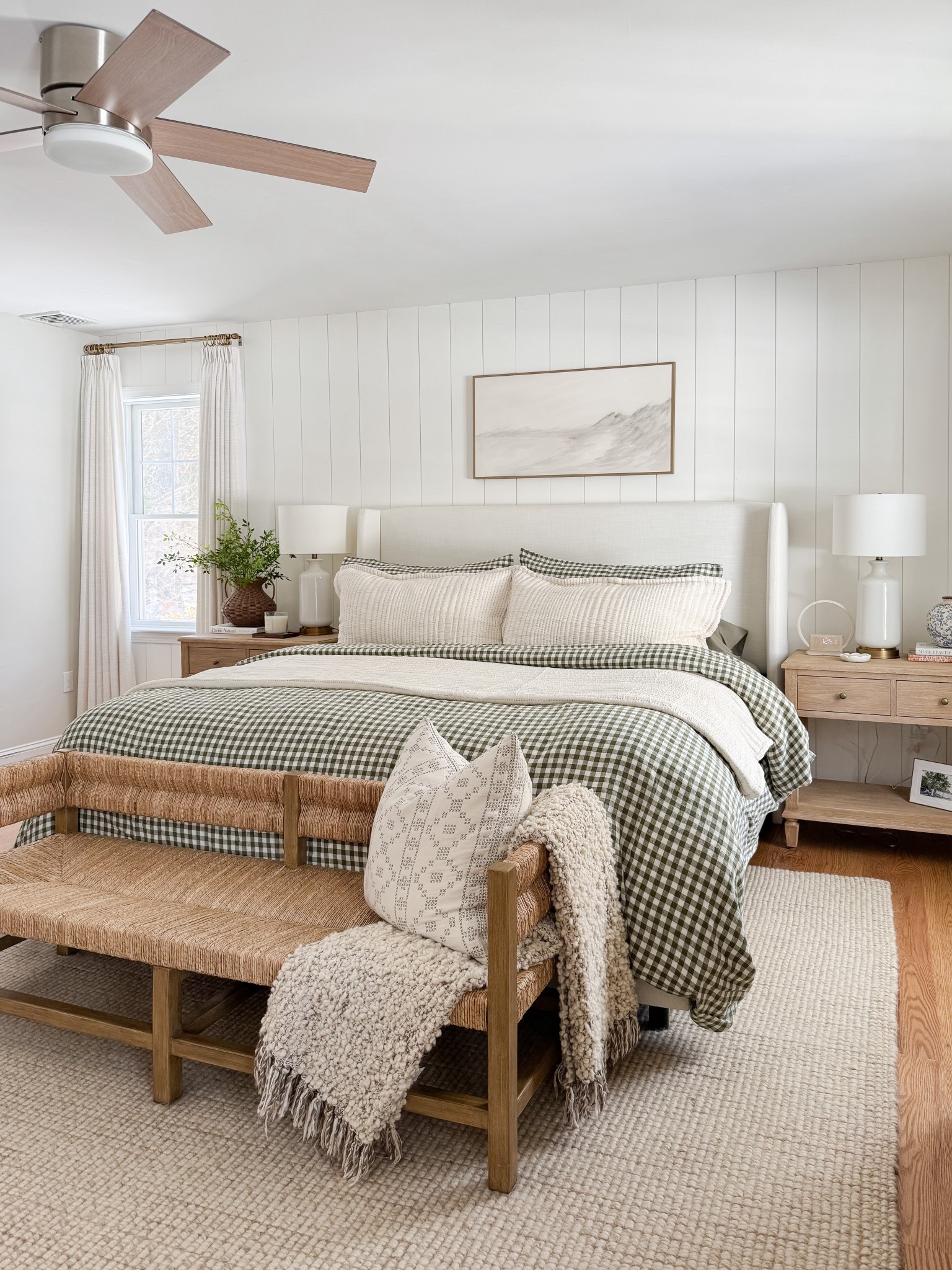Neutral coastal bedroom with gingham bedding, layered throw blankets, textured knit coverlet, and soft patterned pillows. Light wood nightstands and white table lamps create a calm, layered spring bedroom look. 
gingham bedding, neutral bedroom decor, layered bedding, spring bedding, coastal bedroom, throw blanket, knit coverlet, patterned pillows, light wood nightstands, white table lamps, cozy bedroom, serene bedroom style, sherri calnan home

#LTKHome