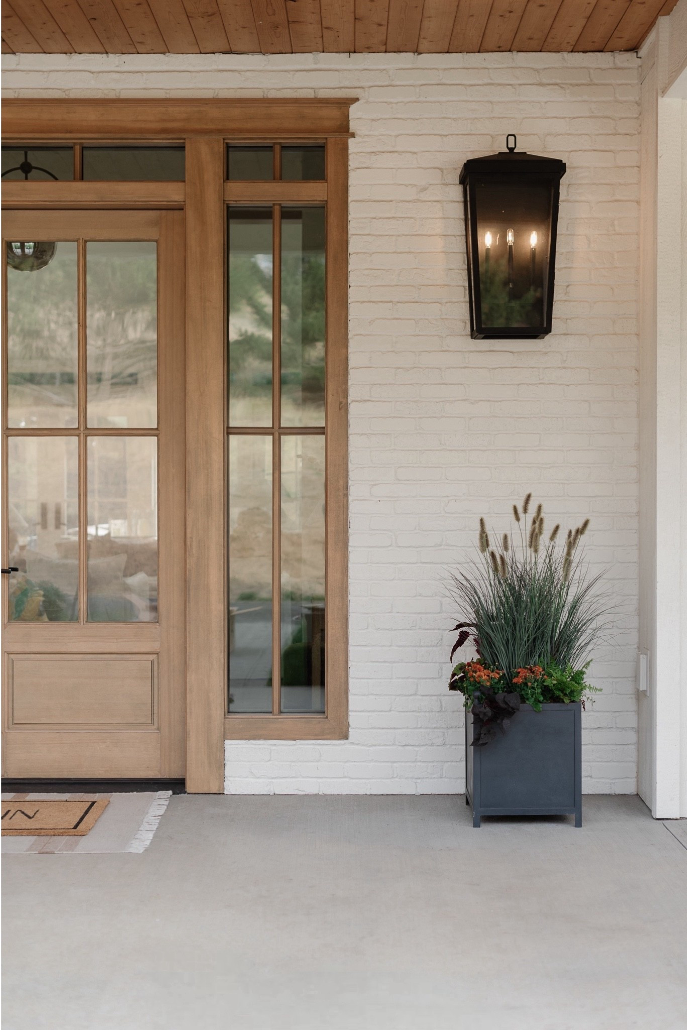 Fall porch planters without a million mums 🙌🏻 I mixed faux ornamental grass with real clearance plants for a full, layered look that’s low maintenance + easy to reuse season after season. Linking the faux grass I used along with my favorite fall porch decor! 🍂

Fall porch, faux plants, doormat m, outdoor lighting, fall decor, home decor, entry, front porch, planter, pot, mcgee & co, studio McGee, Amazon, Amazon home, Target

@Target @mcgeeandco

#LTKHome #LTKSaleAlert #LTKSeasonal