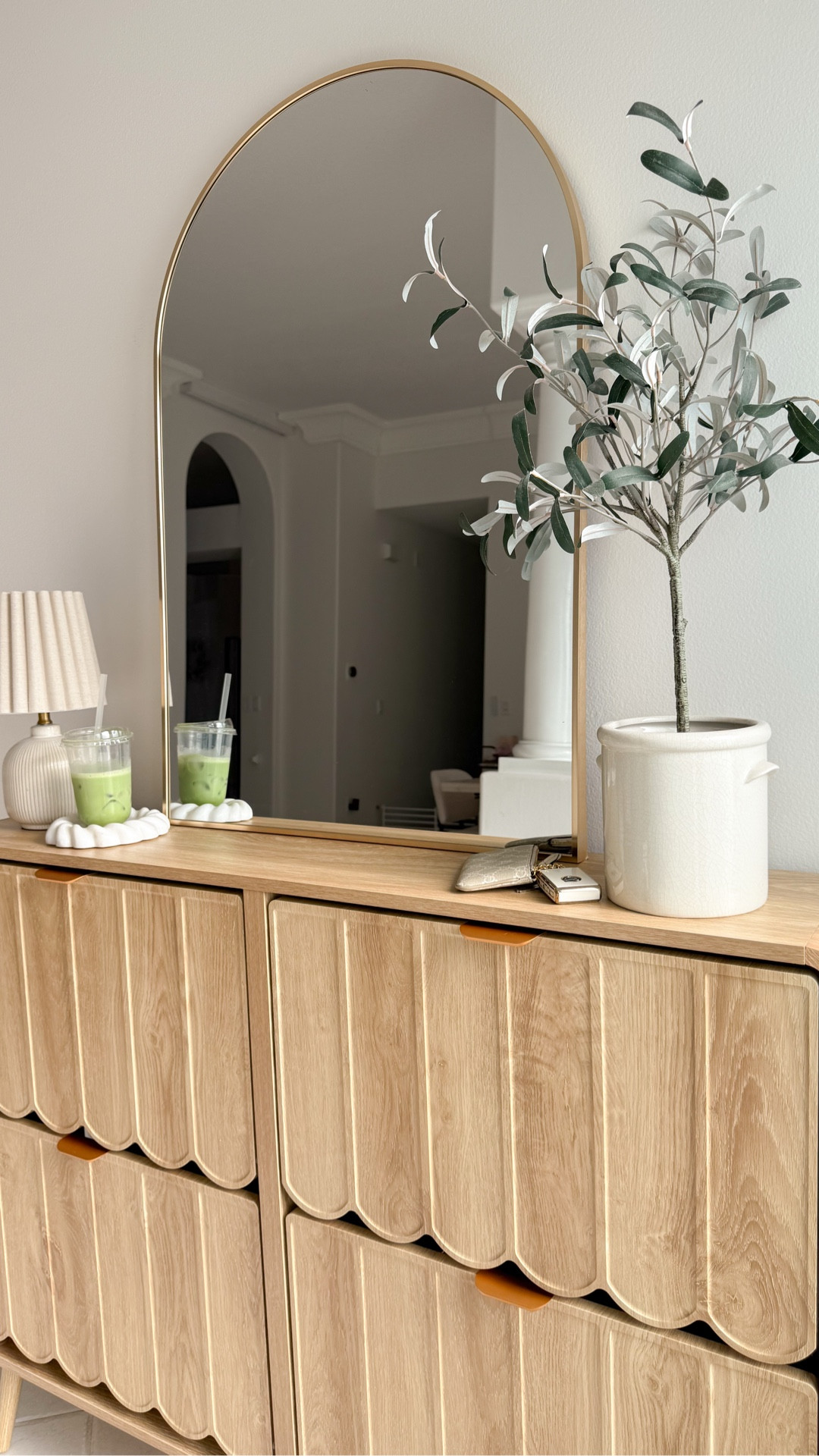 Elevated my entryway with this cute console table with shoe storage 😍 it’s gorgeous and it holds so many pairs of shoes!! 

home organization, affordable home decor, foyer, amazon, scalloped furniture, natural wood table, mini lamp, gold oval mirror, olive tree, fancythingsblog 

#LTKVideo #LTKshoecrush #LTKhome
