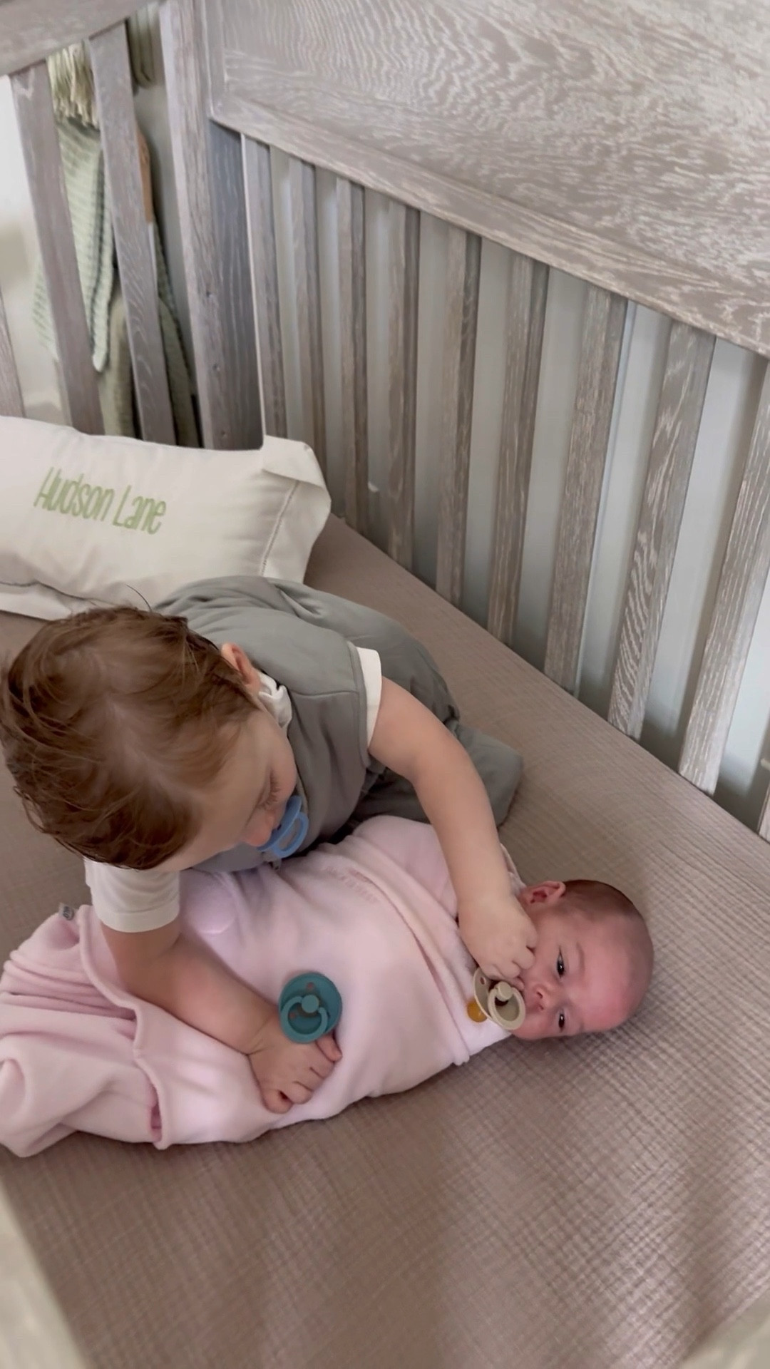 These two little angels are safe and sound all night (and naptime) long in #halosleep, our go-to swaddles and sleep sacks. 😇 Hudson thought he and Ava were having a sleepover when he got to kiss her goodnight! #ad 