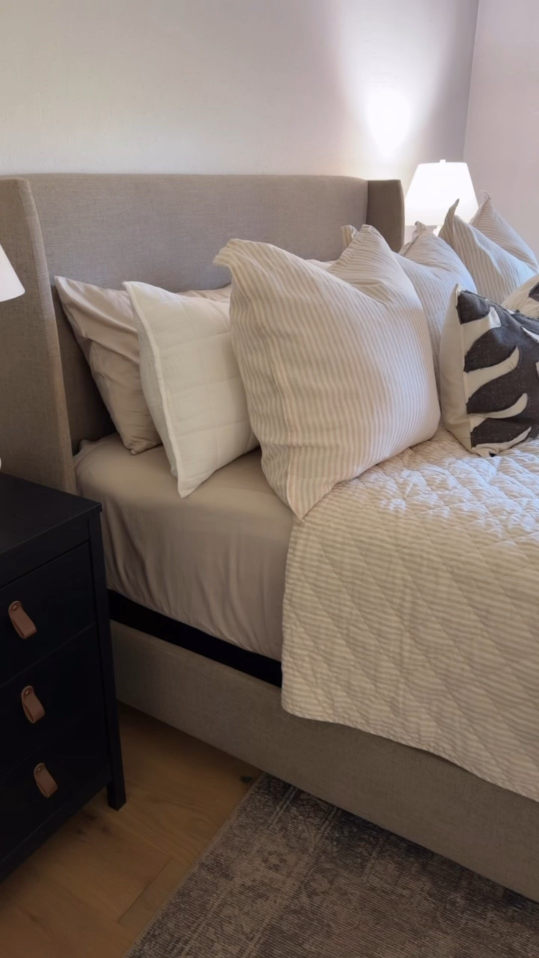 Neutral bedroom decor with layered bedding, warm textures, and soft lighting. 

#LTKHome