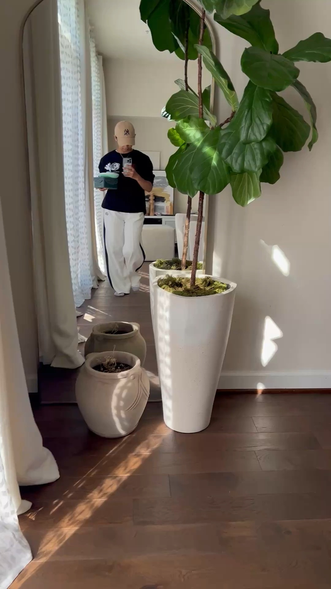 Quick mirror selfie before school Lunch drop-off.
Track pants
Men’s sweatshirt
Simple white t-shirt
Abercrombie and Fitch hat
Shoes and out! 

Also, my planter needs repotting! 