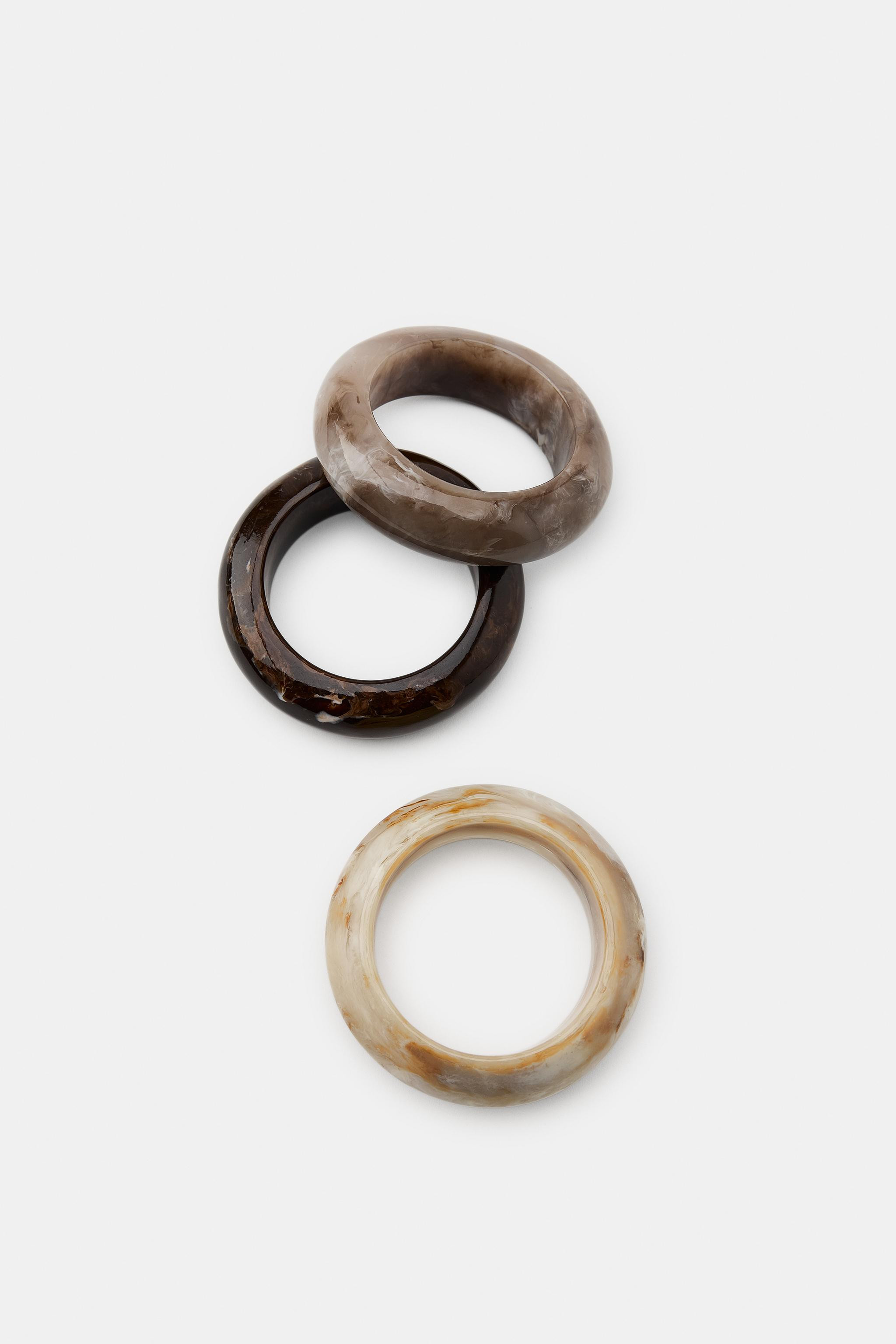 Pack of three colorful rigid resin bracelets. | Zara US