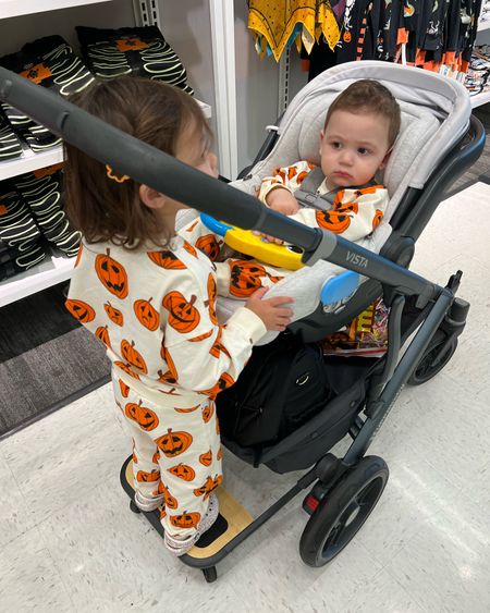 Ellie loves her new uppababy ride along board that attaches to the stroller!so much easier going through the store with this! And I can leave it attached when I fold up the stroller. 

 Matching family Halloween outfits. Family matching. Uppababy vista double stroller. Toddler girl and baby boy Halloween shirts. 

#LTKfamily #LTKSeasonal #LTKHalloween