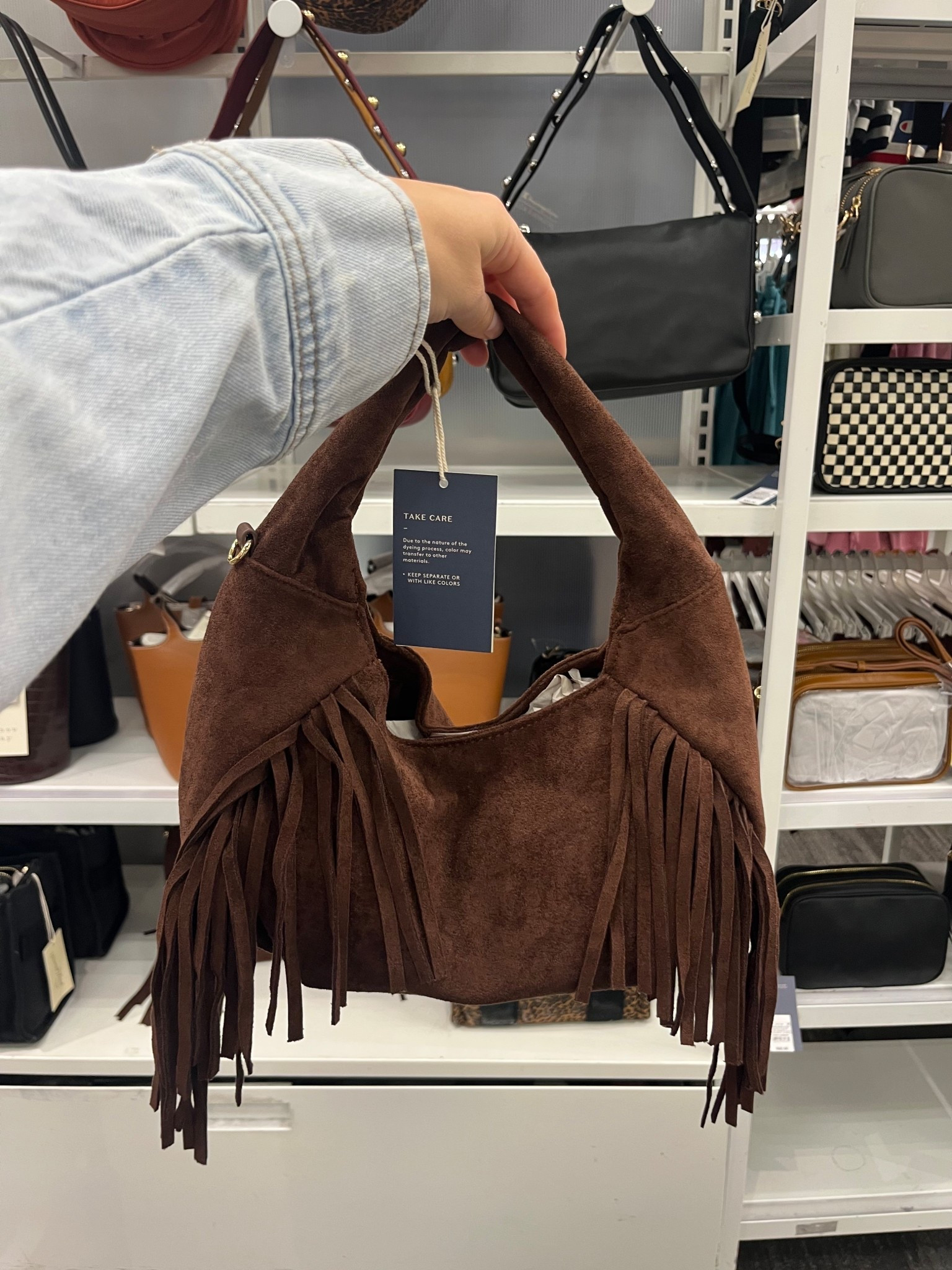 This fringe bag is adorable for fall with a price point of $30! A great trending look for less $ 

Crescent bag, faux suede bag, chocolate brown handbag, fall purse, fringe purse, target find 

#LTKItBag