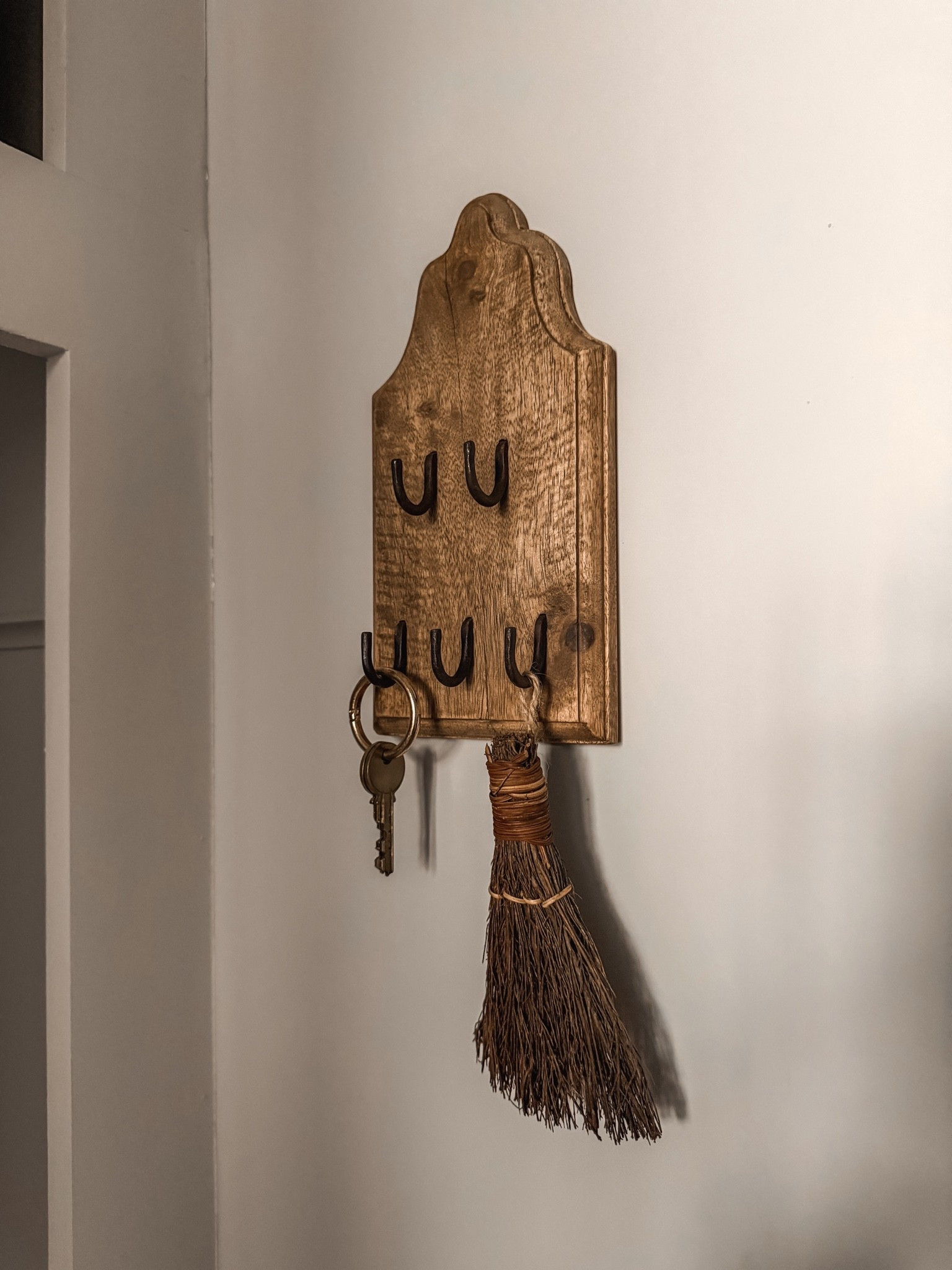 Since my husband won’t use this pretty key holder to actually hang his keys, I hung a mini cinnamon broom I found at Trader Joe’s — smells like fall as soon as you walk in the house! 🍂 

Entryway, mudroom, vintage inspired finds

#LTKHome #LTKSeasonal