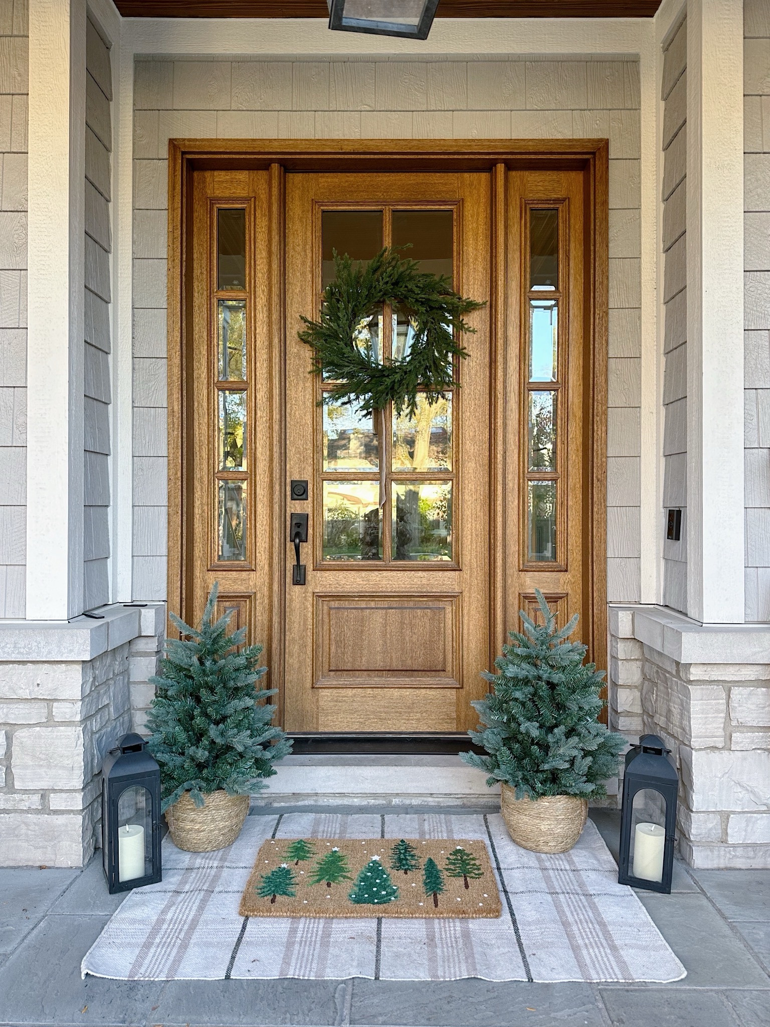 Christmas decor for your front porch!! The cutest holiday doormat, and love this affordable wreath! 🌲

#LTKHoliday #LTKfindsunder50 #LTKhome