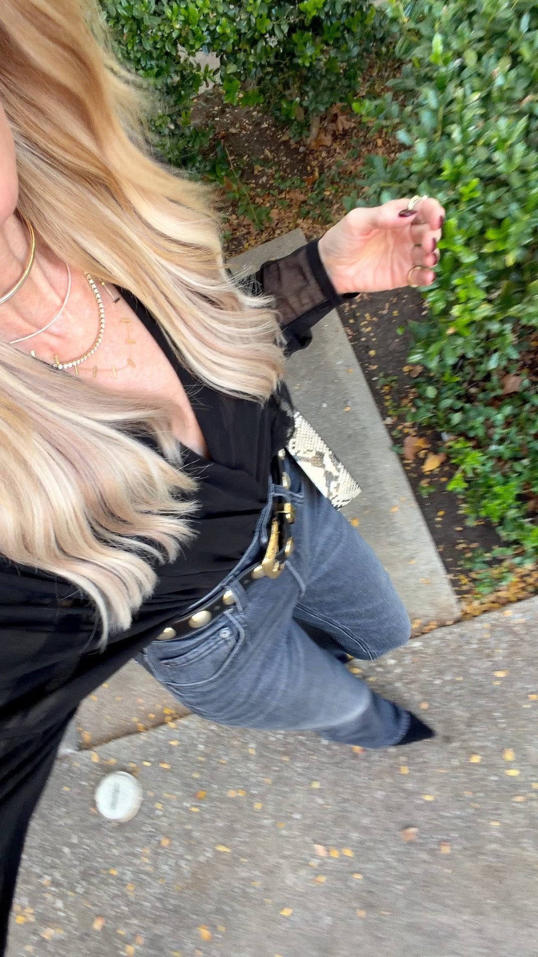 1.	Black sheer bodysuit. Sleek, a little daring, and tucks in seamlessly with no bulk. Fits true to size; I'm wearing an XS.
	2.	High-waisted slim bootcut jeans. This charcoal-gray faded black wash gives the whole look its edge, and the bootcut cut is universally flattering. It lengthens the leg for that model-esque line every time. Fits true to size; I'm in a 24.
	3.	Studded belt. This one is the finishing touch that makes the outfit. Mine is Khaite, but I found a Quince version that looks exactly the same for a fraction of the price, and that's the one I've linked for you.

#LTKootd #LTKgrwm #LTKOver40