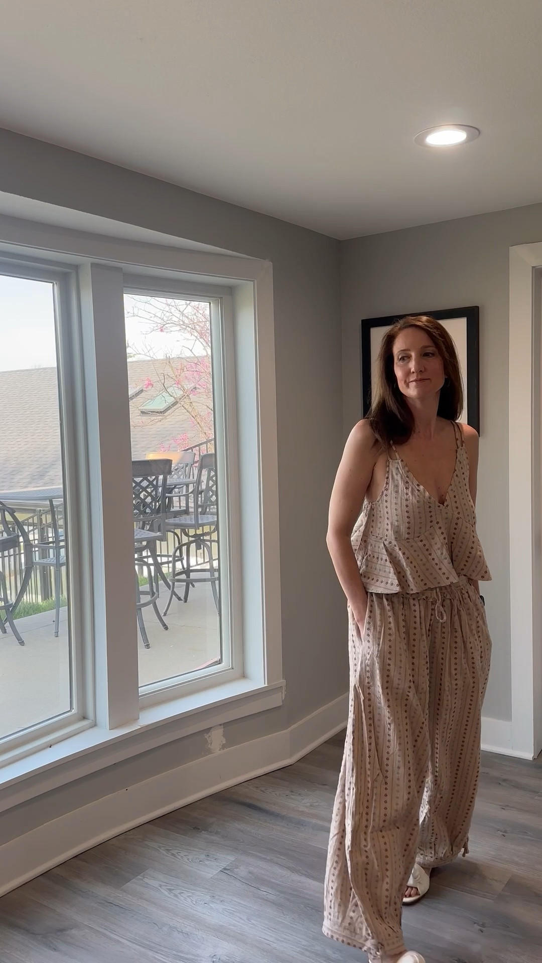 This two-piece set offers the perfect balance of feminine detail and high-end comfort. Check out the link in my bio to shop this look and refresh your own warm-weather rotation! 🌟 #StyleInspo #EyeletDetail #EffortlessStyle #ShopMyLook

My Breezy Boho Style Breakdown
• The Set: I’m wearing a coordinating two-piece set in a light taupe or oatmeal fabric featuring a vertical dotted eyelet pattern.
• The Top: The top is a sleeveless camisole with thin double straps, a deep V-neckline, and a flattering flared peplum hem.
• The Pants: The matching trousers feature a high-waisted fit with a drawstring tie and a dramatic wide-leg silhouette.
• The Accessories: I’ve kept the styling minimal to let the intricate pattern of the set stand out, pairing it with my everyday black fitness tracker.
• The Vibe: This is the definition of "lakeside elegance"—it’s a curated, breathable outfit that captures a relaxed yet polished energy.

@VICI 
two piece set, matching coordinates, taupe eyelet set, wide leg pants, peplum camisole, neutral summer outfit, boho chic style, lakeside fashion, sleeveless V-neck top, effortless vacation wear, LTKstyle

#LTKFestival #LTKootd