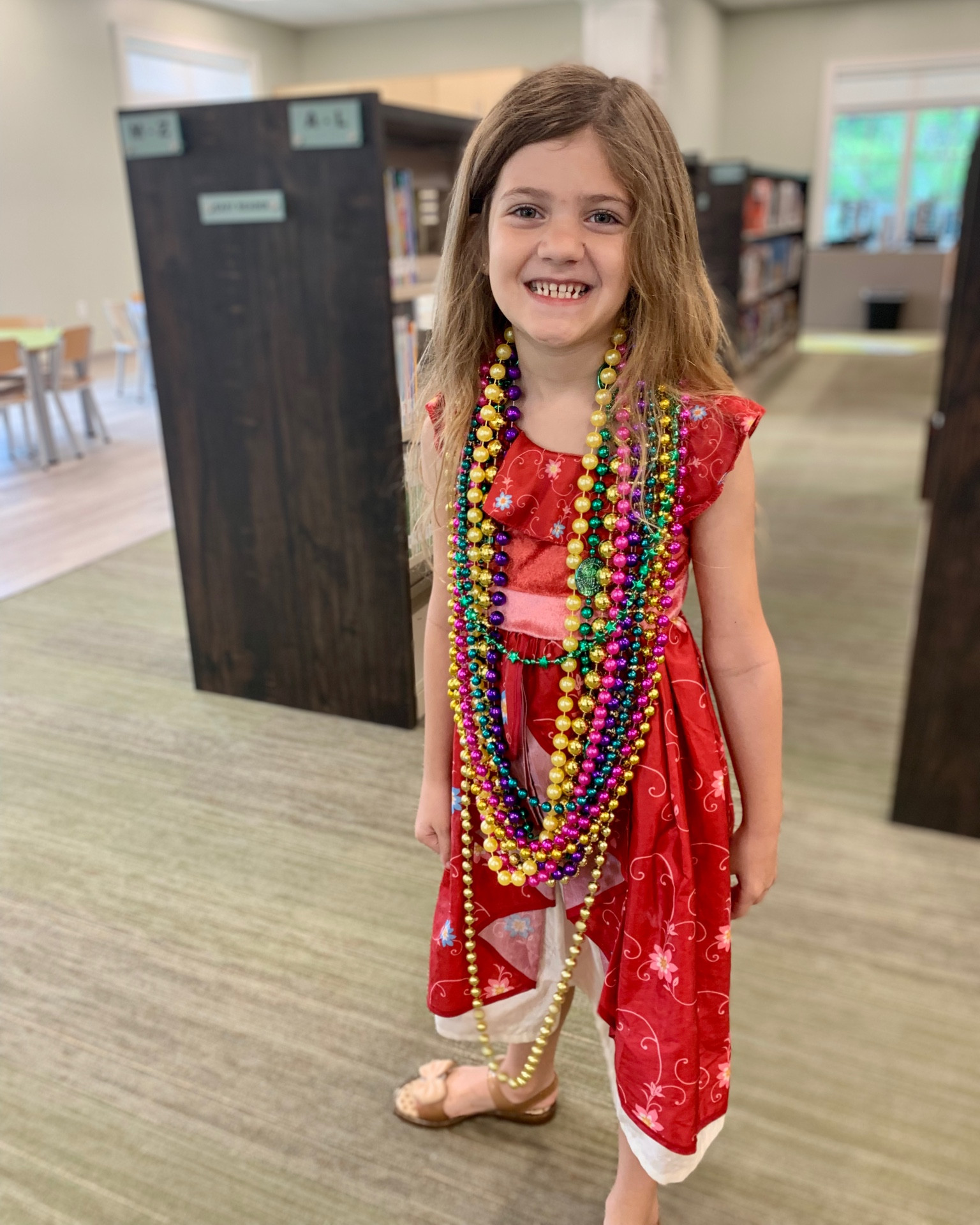 Leilani’s look of the day, spring break style! This girl is so glad to have a break from school uniforms so she can get creative with girls’ fashion. 

She’s wearing a Little Adventures Dress Up dress, which we love because it’s comfortable, washable and glitter-free. Gold Mini Melissa princess bow sandals and parade beads complete her spring break look. 

#LTKshoecrush #LTKkids #LTKfamily