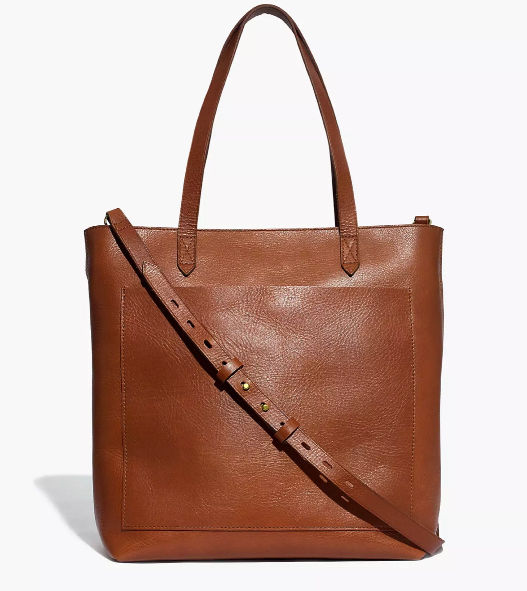 What goes into this zippered version of our best-selling Medium Transport Tote? Here it is by the numbers: 2 pieces of fine leather are used for the body. 2 ways to carry: with the top handles or the detachable shoulder strap. 1 exterior pocket for those things you gotta grab fast. 1 interior side zip pocket to keep your keys, phone and wallet at the ready. 24: the number of hours in a day that this bag looks cool. How often you'll reach for it? 500 gazillion times.  

#LTKitbag #LTKSeasonal #LTKSale