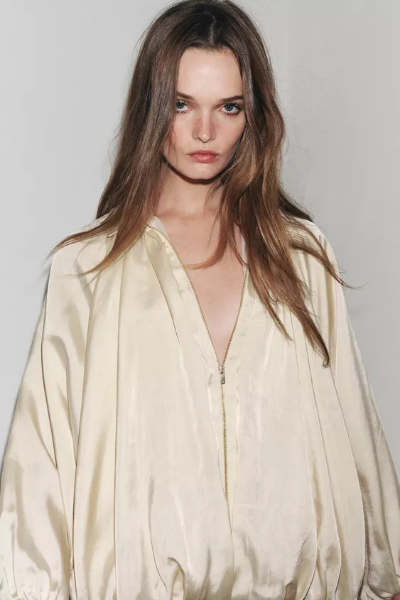 ZARA WOMAN COLLECTIONBomber jacket made of lyocell yarn. Lapel collar and long puffed sleeves. Pu... | Zara US