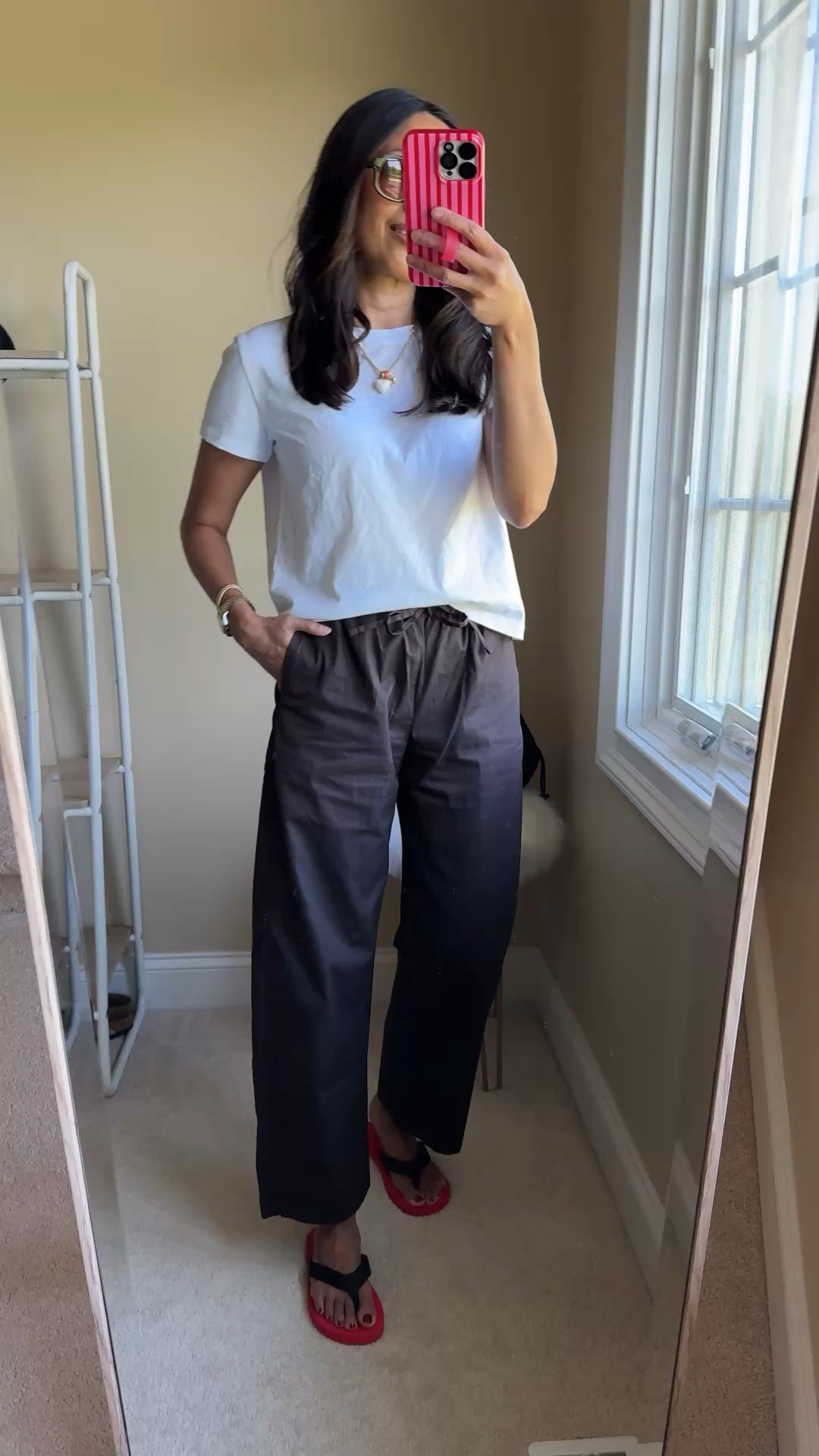 What I wore today: Summer pants outfit. 
- I added a pair of pull on cotton poplin pants to my closet this year and they are becoming my go-to bottoms when it’s not a shorts day. So easy and comfy. I sized down in exact pair. 
- A favorite t-shirt of all time. All cotton. And the fit is great. I wear true to size and a size up for different outfits. 
- Pop of color. I’m liking red a lot this season.  Linking options for red flip flops. 
- Sunglasses are comfortable and look chic. 
- Some favorite summer jewelry: charm necklace and barcelets.

#LTKOver40 #LTKootd