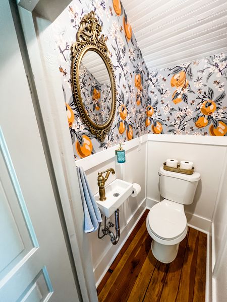 Every powder room deserves a surprise punch of color and pattern!   
.
.
.
.
#powderroom #lemonwallpaper #bluebathroom #wallpaper

#LTKFind #LTKunder50 #LTKhome