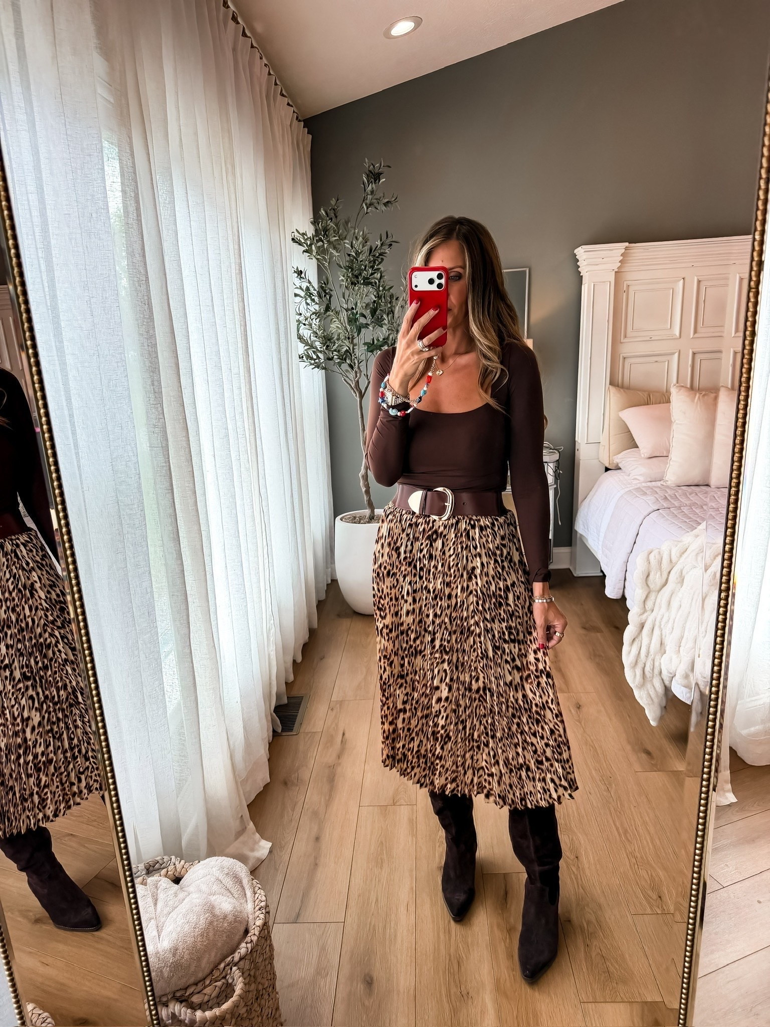 This leopard pleated skirt is such a fun fall piece, especially paired with chocolate brown. I love the movement of the pleats with the tall boots and wide belt for a look that feels dressed up without being too much.

leopard skirt, pleated midi skirt, fall skirt outfit, chocolate brown top, tall boots, fall fashion, animal print skirt, autumn outfit, women’s fall style, midi skirt outfit, TheMomInStyle

#LTKootd #LTKSeasonal #LTKOver40