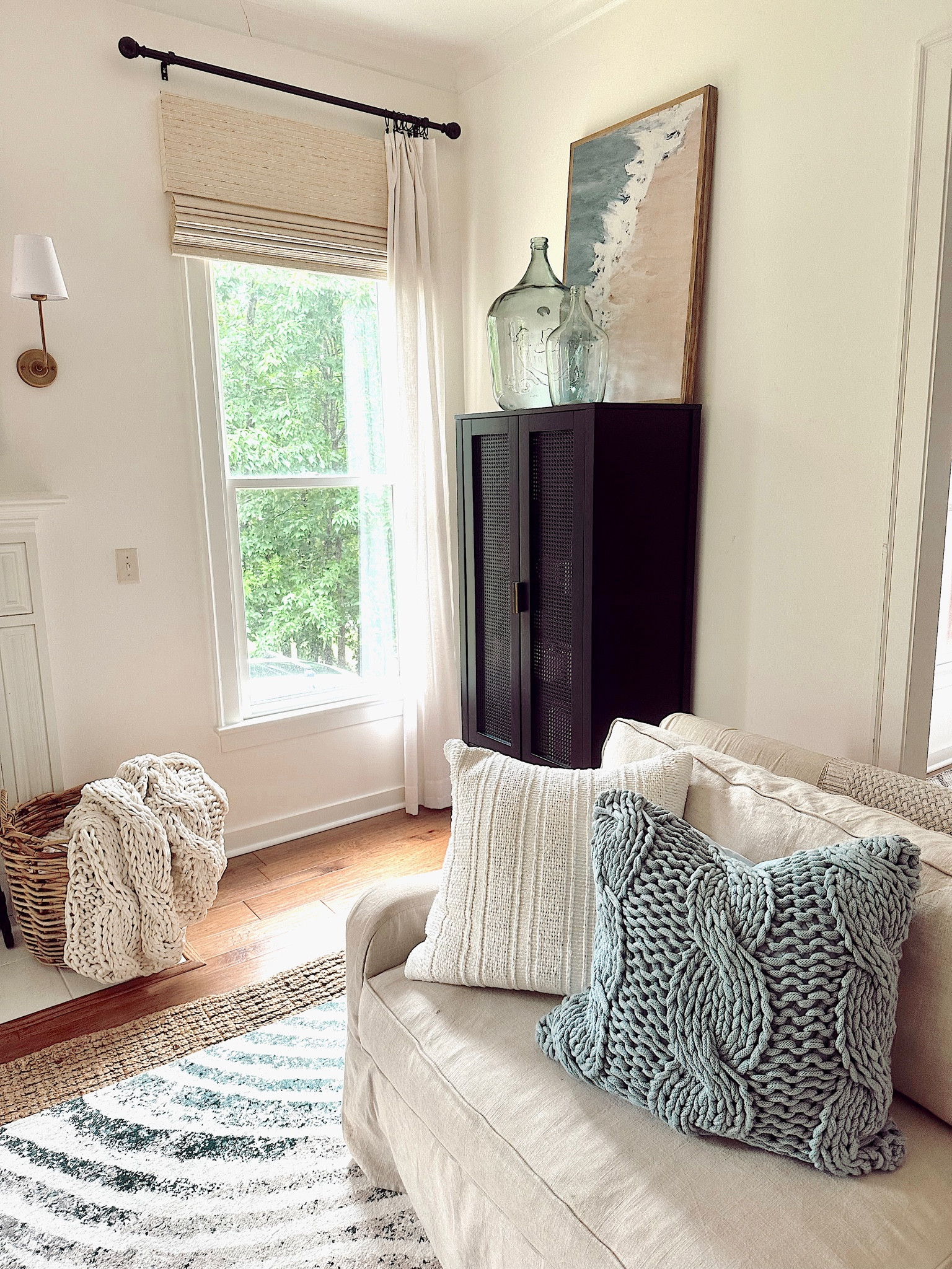 Summer living room // I wanted to add splashes of blue for the summer; it was easy to do by adding blue pillows and artwork with blue in it! Use code: SHEGAVEITAGO for s discount on the artwork  

#LTKSeasonal #LTKhome #LTKsalealert