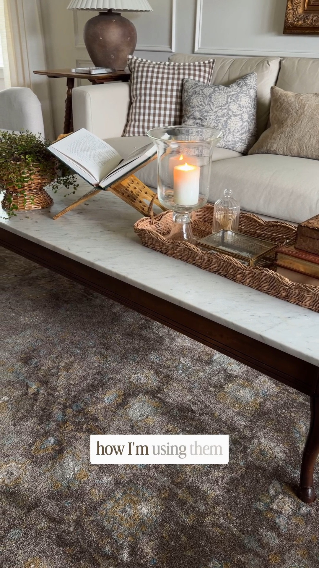 Coffee table decor. Scalloped wicker tray, pedestal basket, wood book holder, hurricane candle holder, angel vine plant

#LTKHome
