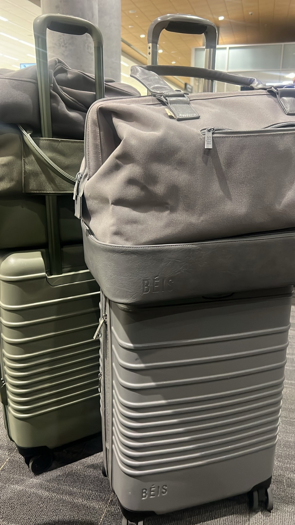 The best carry on luggage from Beis! Gray and olive carry on roller bag and weekender bag. 

#LTKTravel