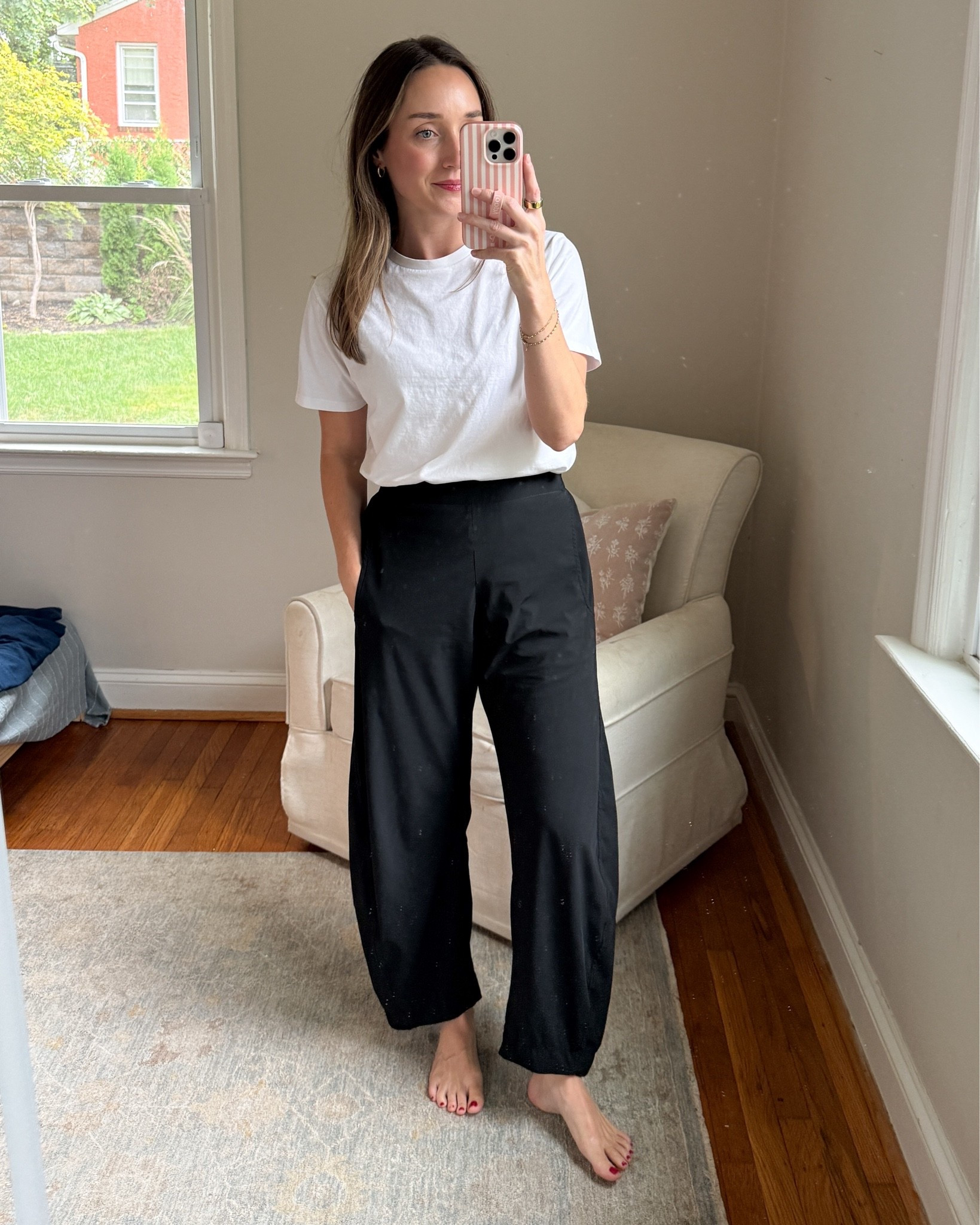 Wearing small pants. These barrel leg athletic material pants are perfect for travel or rainy days! ￼