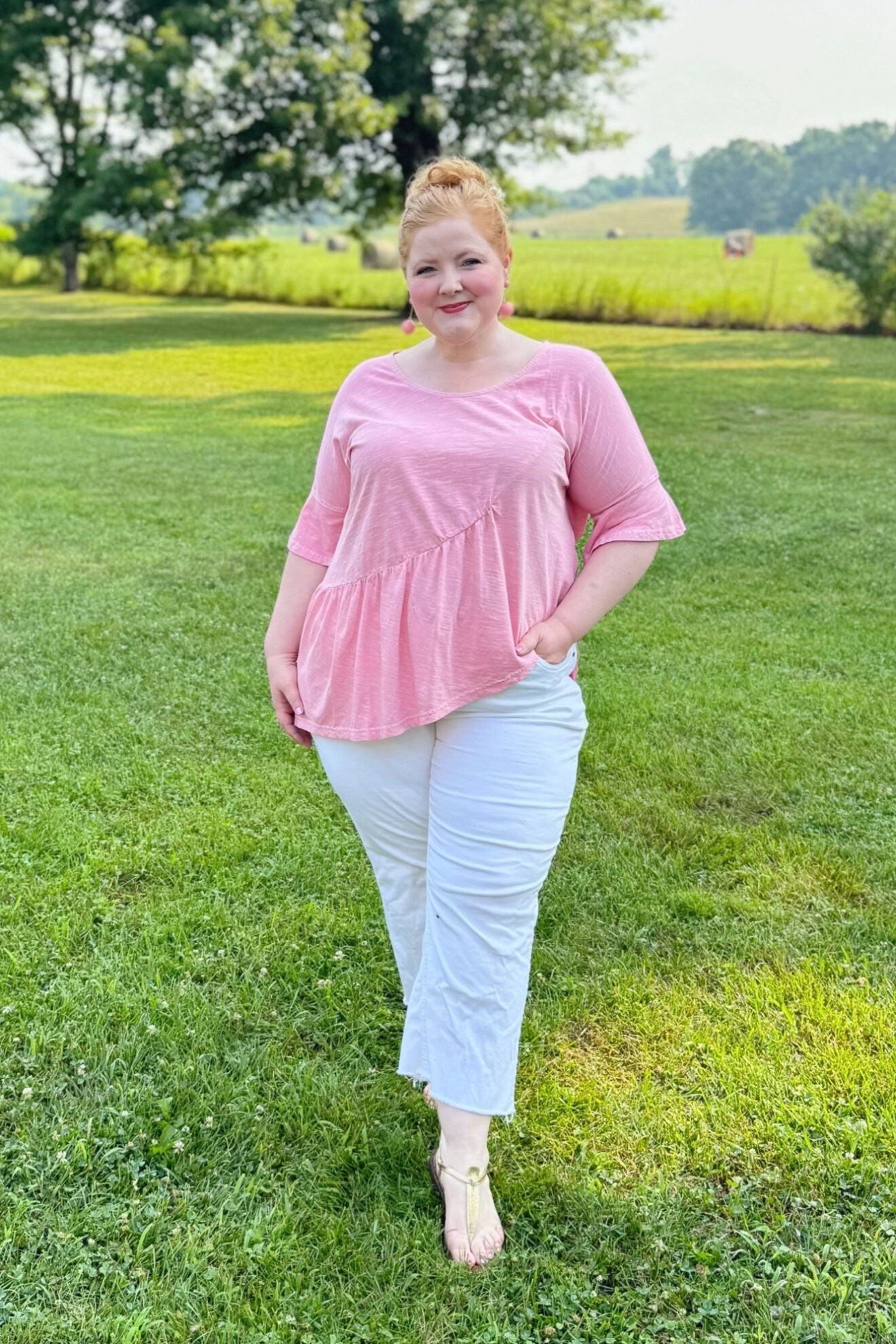 Slub Knit Tee and White Jeans Outfit

I’m wearing this Asymmetric Flounce Panel Short Sleeve Tee (sizes 12/14-32/34; $45.95) in the size 16/18 and these Claire 7/8 White Stretch Jeans (sizes 12-30; $69.95) in the size 18. I love a slub knit tee in the summertime because the fabric is so light and airy that it feels like wearing nothing at all. This top also comes in two pretty sun-bleached hues: this pink and and aqua blue. I also like the longer length of it and the asymmetrical cut with the flounce for some visual interest.

These white jeans have a medium rise, lots of stretch, and a kick boot silhouette with a frayed hem. The length is so great for summer, and the silhouette is wearable with so many different style tops. They come in several washes including classic denims, and I think I may have to order another pair for fall! Use code WWWULLA to shop this tee + jeans combo for just $75!

#LTKootd #LTKMidsize #LTKPlusSize