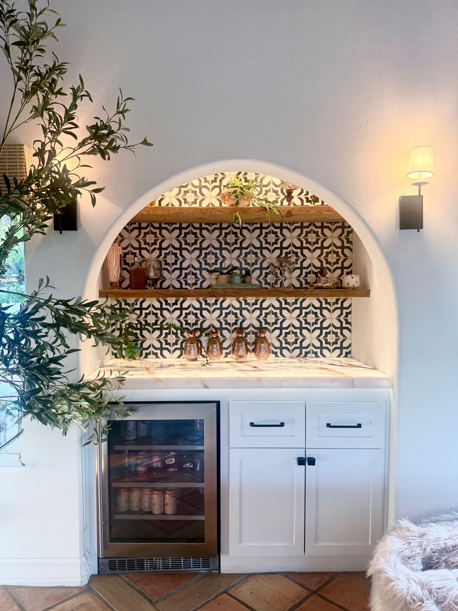 I love how our Spanish style bar turned out!

We did a full remodel (check out the before pics on my Instagram @marneys_tidbits). We added this beautiful tile, marble countertop, mini fridge, new cabinets, wood shelves and black sconces. Then decorated with a large faux olive tree, pineapple decor and candles for a modern Spanish vibe. 

#pineapples #sconce #spanishtile #marneystidbits #artificialolivetree

#LTKHome #LTKgrwm #LTKSaleAlert