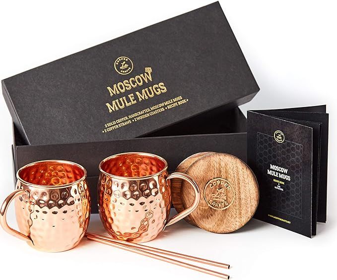 Moscow Mule Copper Mugs Set - 2 Authentic Handcrafted Copper Mugs (16 oz.), 2 Straws, 2 Solid Woo... | Amazon (US)